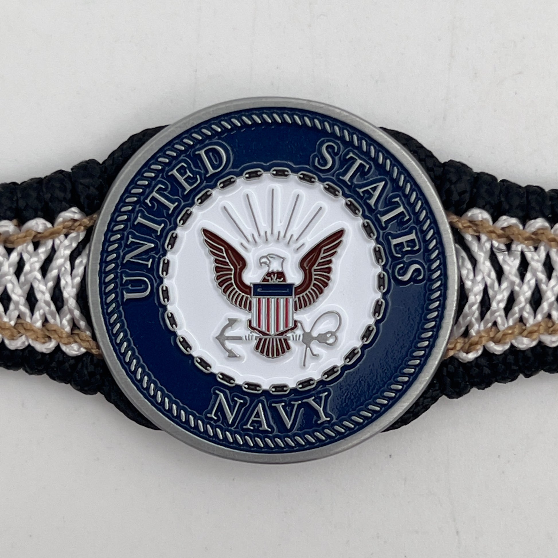 Thin, narrow, flexible and comfortable braided United States Marine Corps bracelet featuring an antique silver plated United States Navy medallion, a black Cobra style tactical buckle and woven with black Type-1 paracord and Gold adn White nano cord.