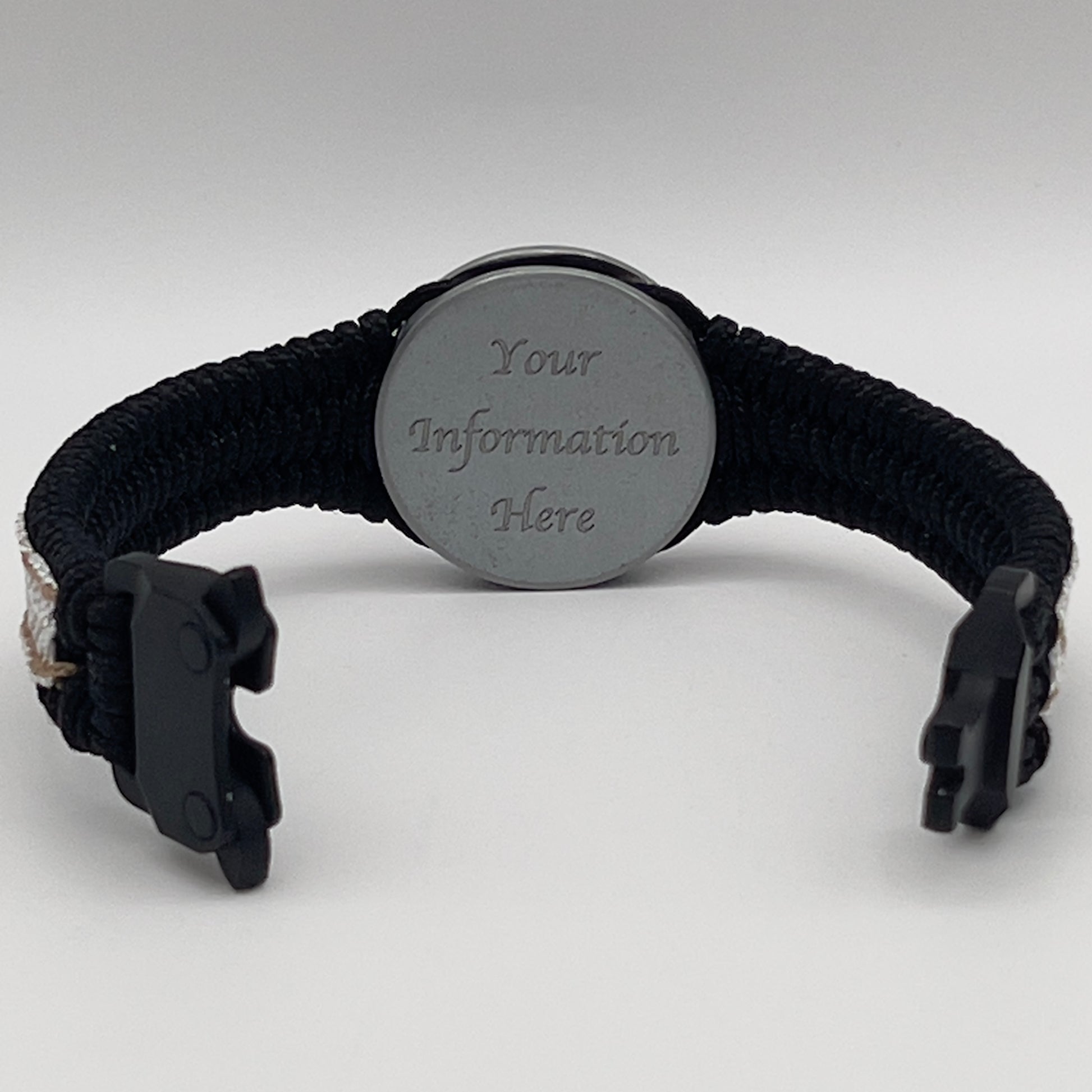 Thin, narrow, flexible and comfortable braided United States Marine Corps bracelet featuring an antique silver plated United States Navy medallion, a black Cobra style tactical buckle and woven with black Type-1 paracord and Gold adn White nano cord.