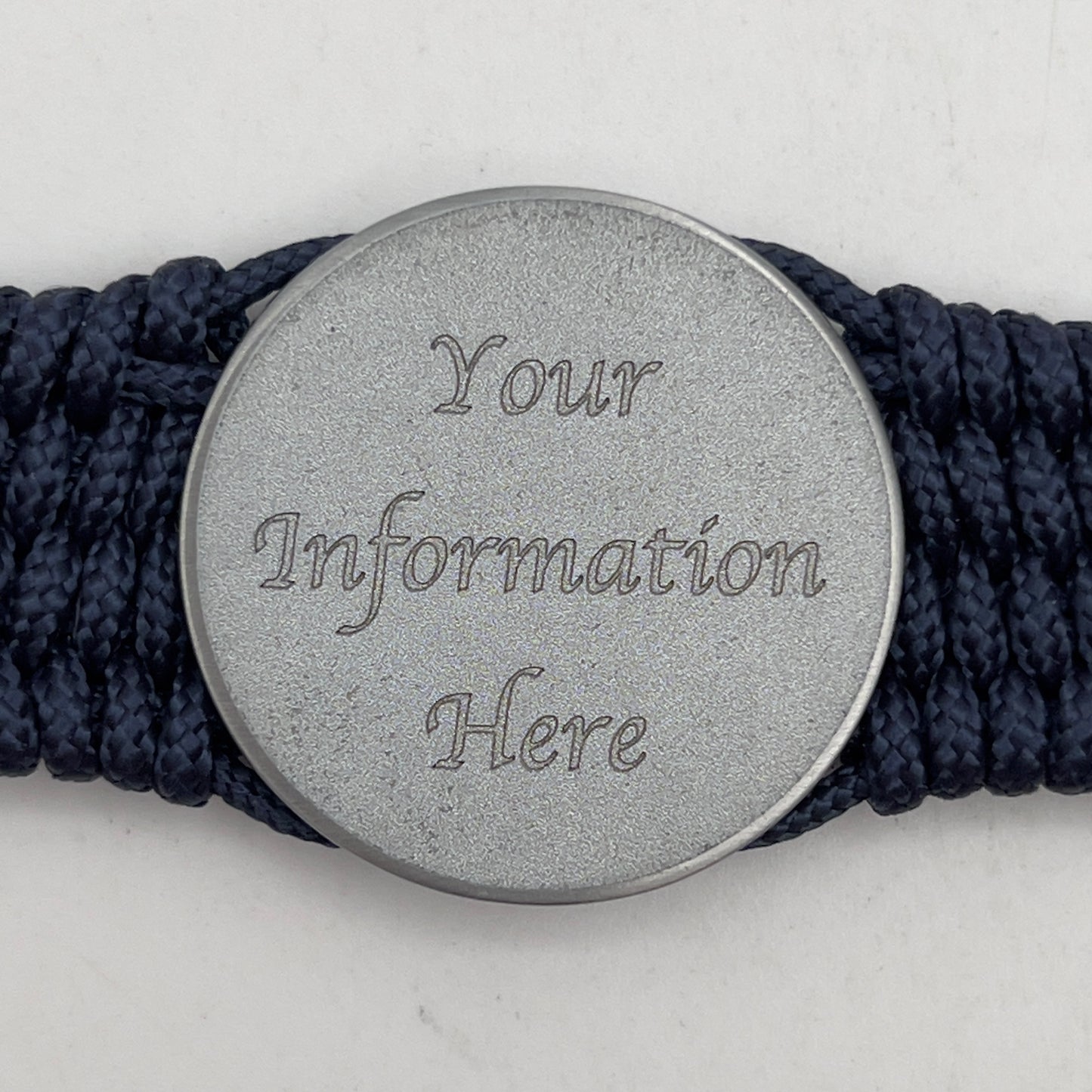Thin, wide, flexible and comfortable braided United States Navy bracelet featuring an antique silver plated Navy medallion, a black Cobra style tactical buckle and woven with Navy Blue Type-1 paracord.