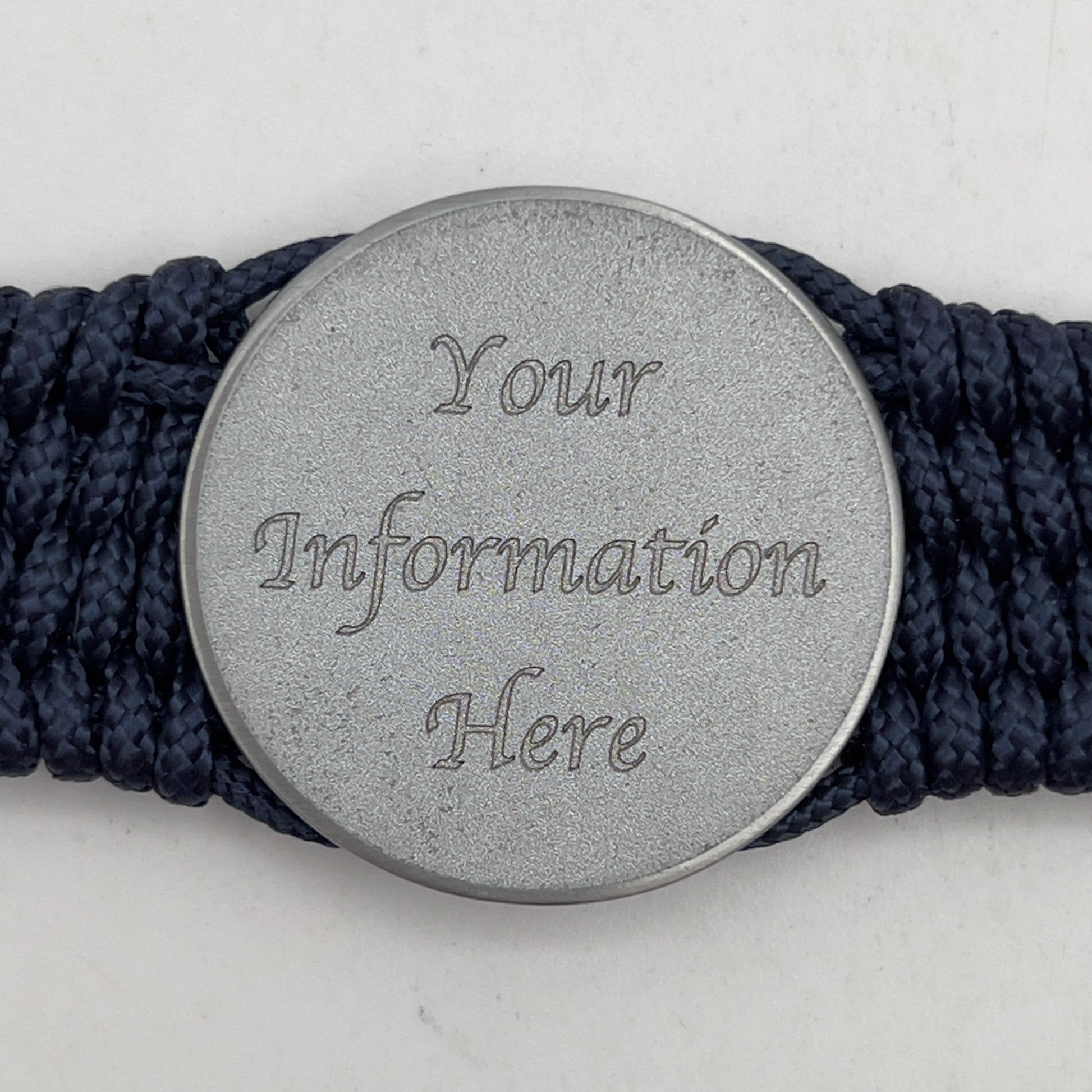 Thin, wide, flexible and comfortable braided United States Navy bracelet featuring an antique silver plated Navy medallion, a black Cobra style tactical buckle and woven with Navy Blue Type-1 paracord.