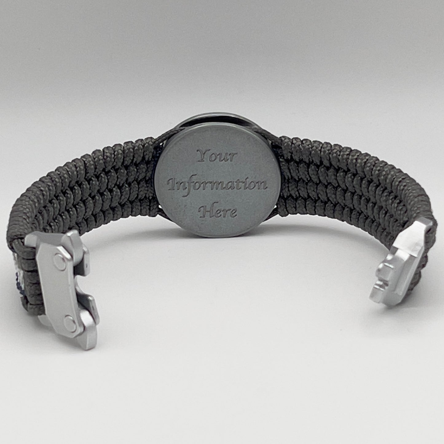 Thin, wide and comfortable braided United States Navy bracelet featuring an antique silver plated Navy medallion, a silver Cobra style tactical buckle and woven with Charcoal Gray Type-1 paracord and Nay Blue and White nano cord.