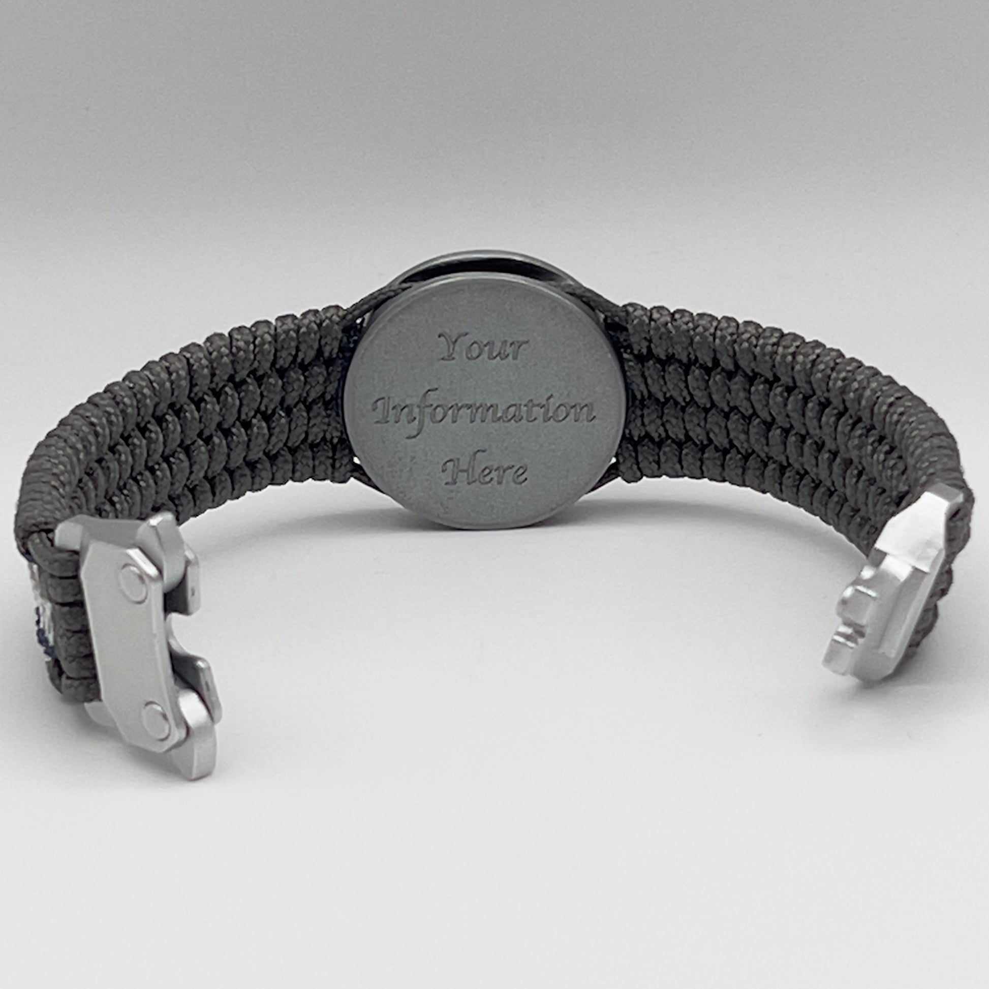 Thin, wide and comfortable braided United States Navy bracelet featuring an antique silver plated Navy medallion, a silver Cobra style tactical buckle and woven with Charcoal Gray Type-1 paracord and Nay Blue and White nano cord.