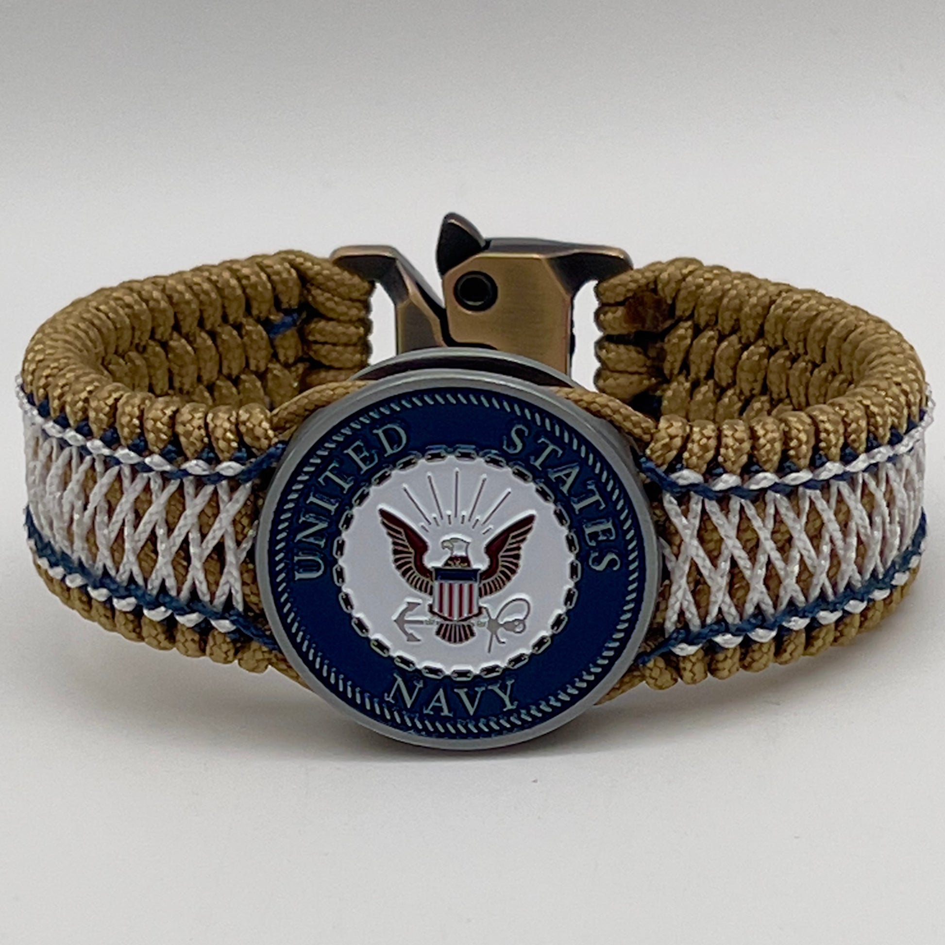Thin, wide and comfortable braided United States Navy bracelet featuring an antique silver plated Navy medallion, a gold Cobra style tactical buckle and woven with gold Type-1 paracord and Navy Blue and White nano cord.