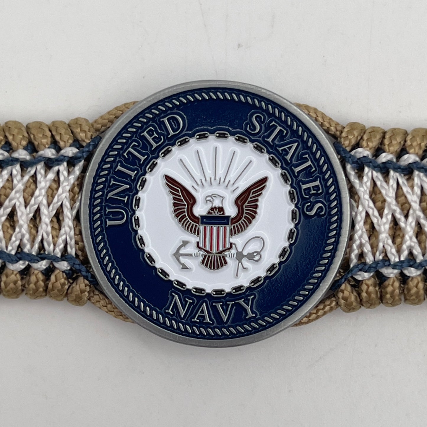 Thin, wide and comfortable braided United States Navy bracelet featuring an antique silver plated Navy medallion, a gold Cobra style tactical buckle and woven with gold Type-1 paracord and Navy Blue and White nano cord.