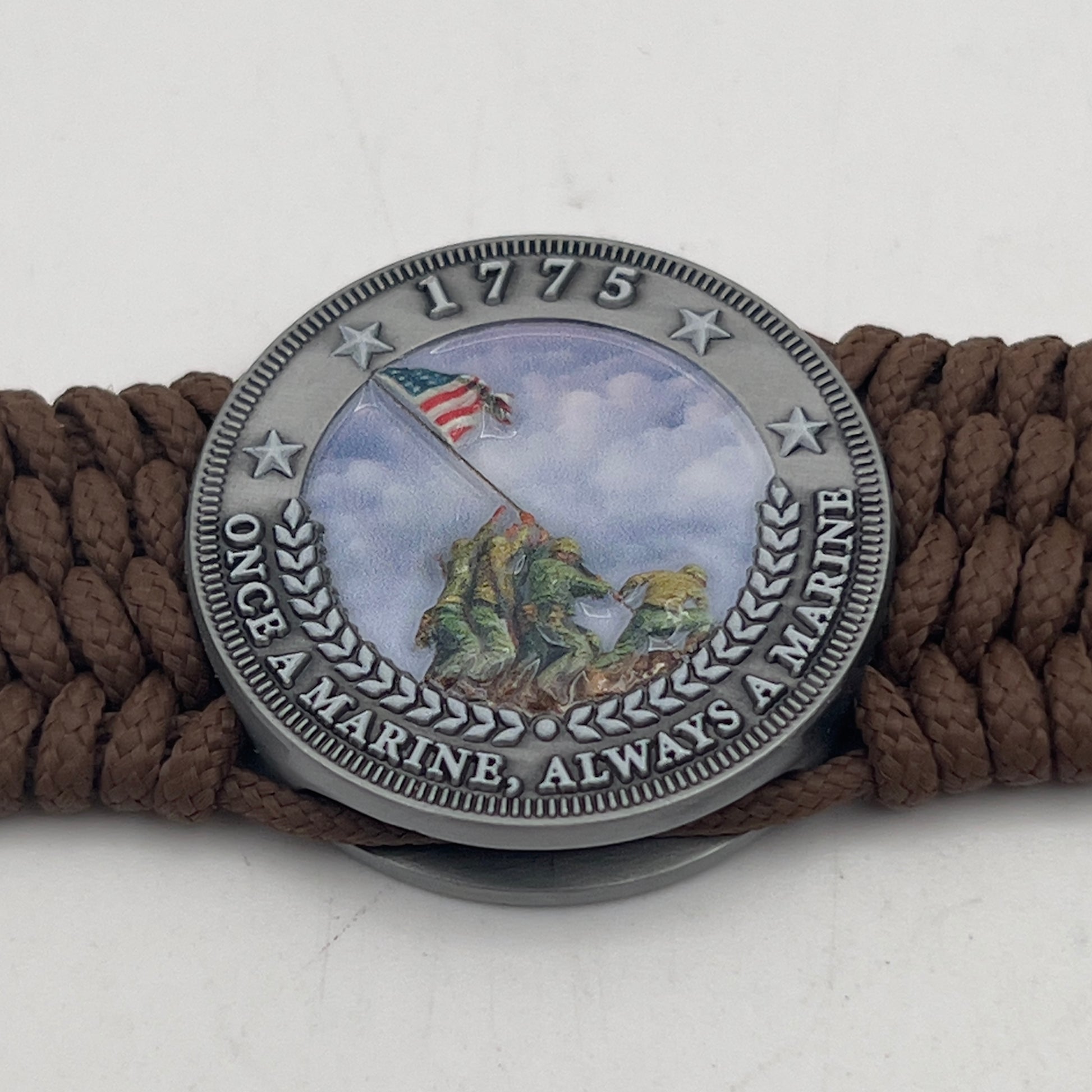 Thin, wide, flexible and comfortable braided United States Marine Corps Iwo Jima bracelet featuring an antique silver plated UV painted Iwo Jima flag raising medallion, a silver Cobra style tactical buckle and woven with Coyote Brown Type-1 paracord.