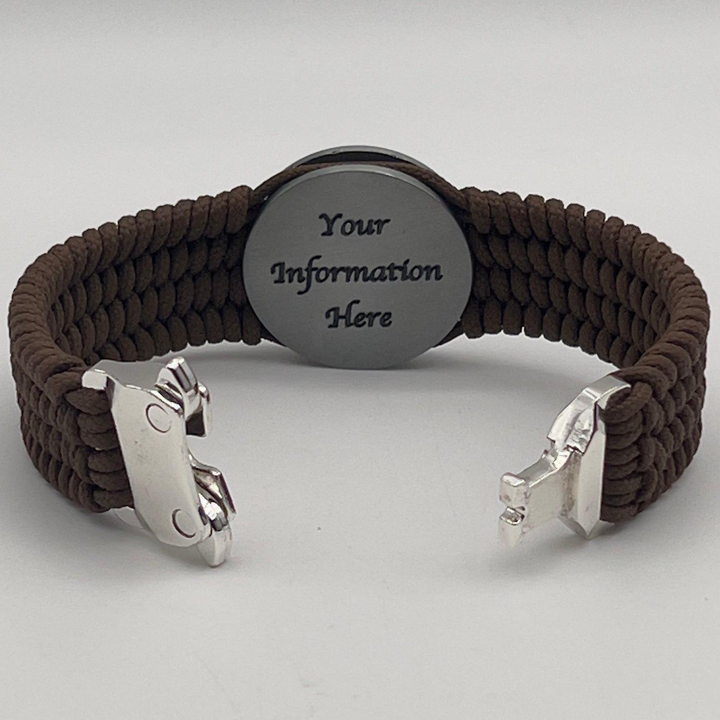 Thin, wide, flexible and comfortable braided United States Marine Corps Iwo Jima bracelet featuring an antique silver plated UV painted Iwo Jima flag raising medallion, a silver Cobra style tactical buckle and woven with Coyote Brown Type-1 paracord.