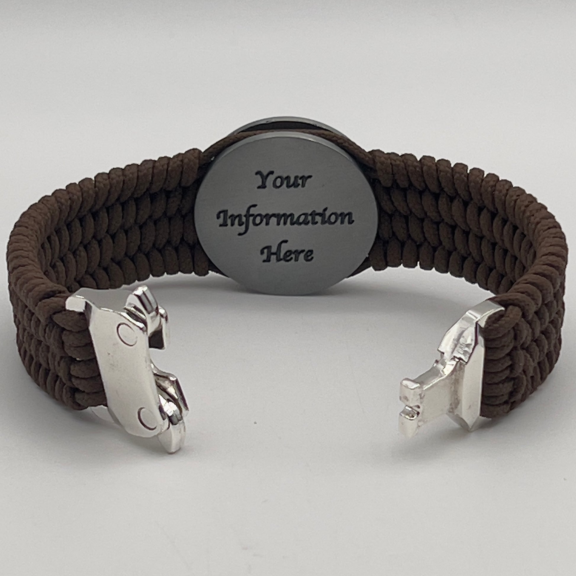 Thin, wide, flexible and comfortable braided United States Marine Corps Iwo Jima bracelet featuring an antique silver plated UV painted Iwo Jima flag raising medallion, a silver Cobra style tactical buckle and woven with Coyote Brown Type-1 paracord.
