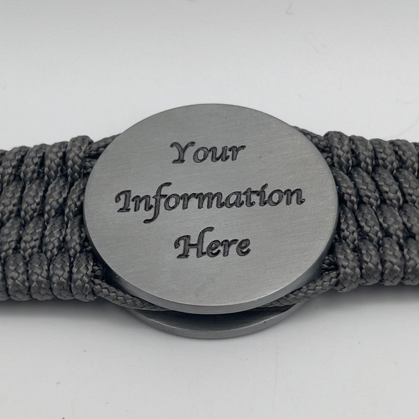 Thin, wide, flexible and comfortable braided United States Marine Corps Iwo Jima bracelet featuring an antique silver plated Iwo Jima flag raising medallion, a silver Cobra style tactical buckle and woven with gray Type-1 paracord.