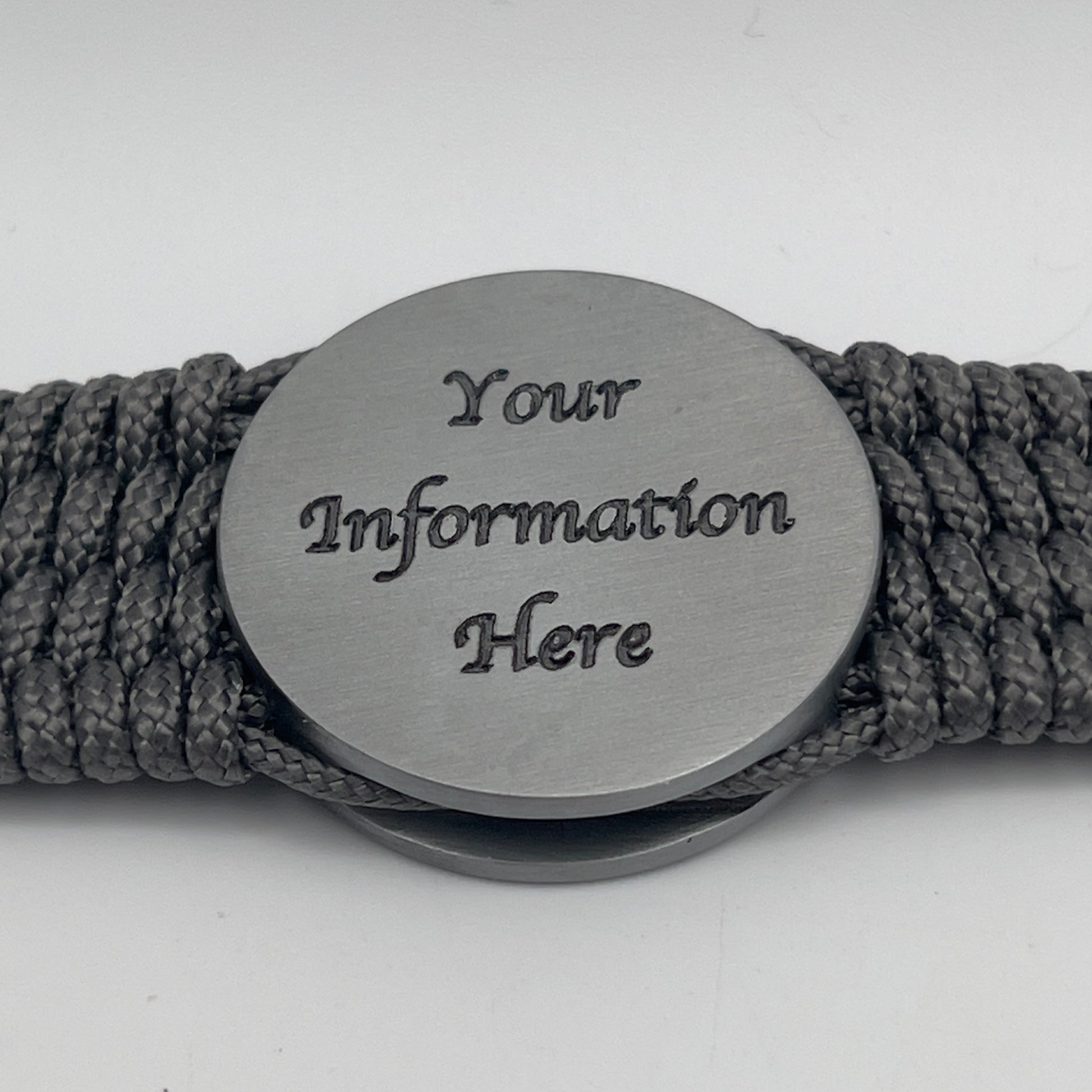 Thin, wide, flexible and comfortable braided United States Marine Corps Iwo Jima bracelet featuring an antique silver plated Iwo Jima flag raising medallion, a silver Cobra style tactical buckle and woven with gray Type-1 paracord.