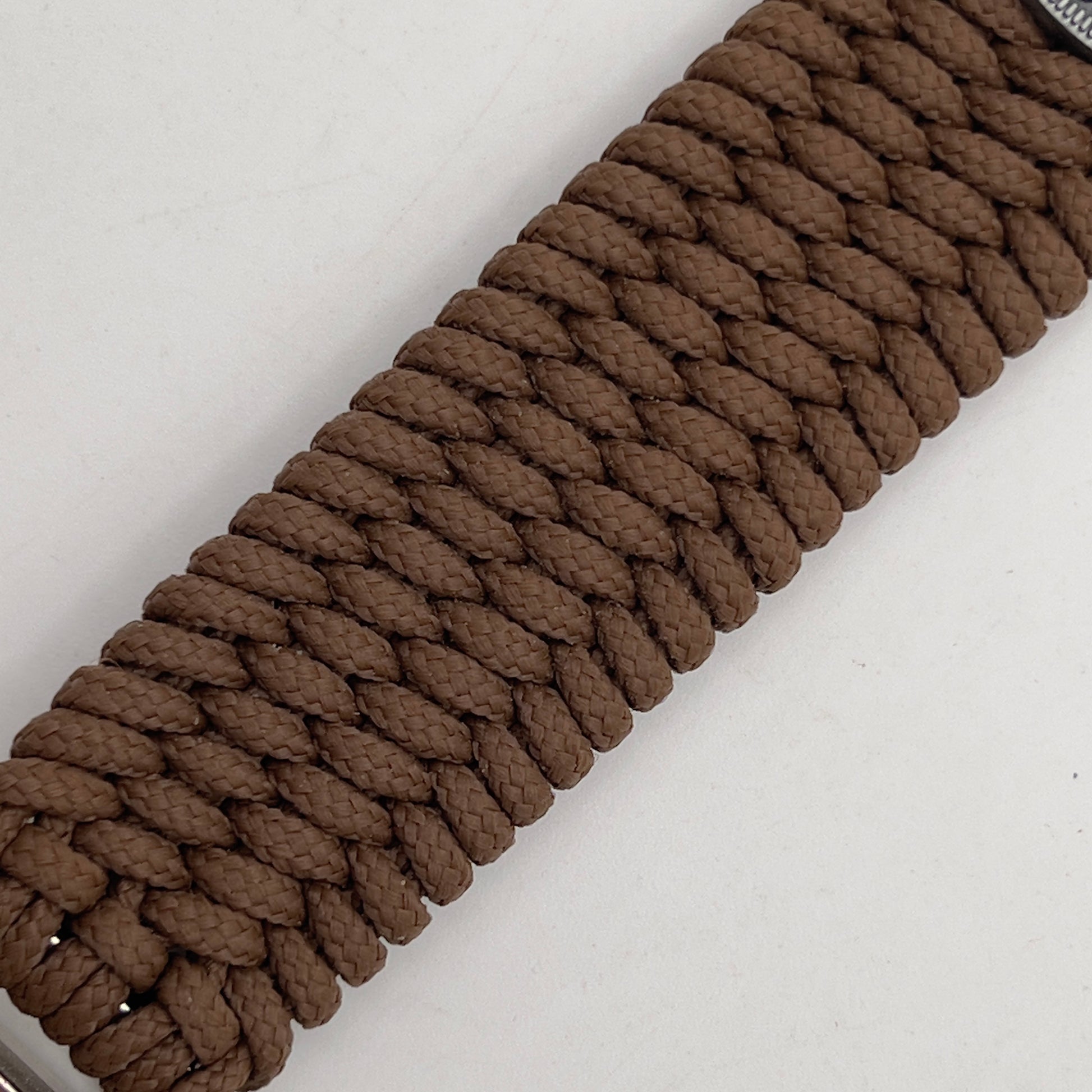 Thin, wide, flexible and comfortable braided United States Marine Corps Iwo Jima bracelet featuring an antique silver plated Iwo Jima flag raising medallion, a silver Cobra style tactical buckle and woven with Coyote Brown Type-1 paracord.