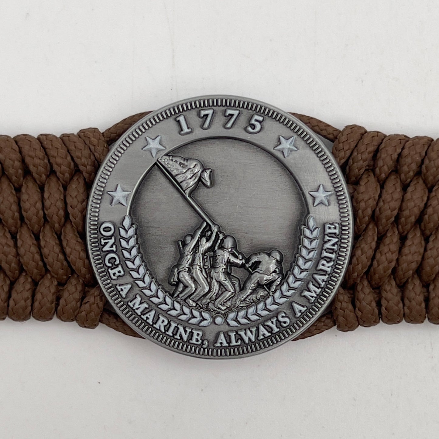 Thin, wide, flexible and comfortable braided United States Marine Corps Iwo Jima bracelet featuring an antique silver plated Iwo Jima flag raising medallion, a silver Cobra style tactical buckle and woven with Coyote Brown Type-1 paracord.