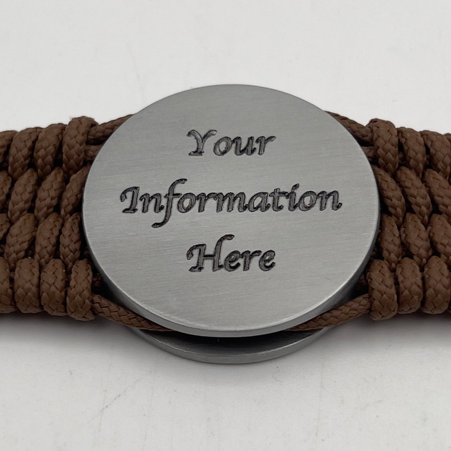 Thin, wide, flexible and comfortable braided United States Marine Corps Iwo Jima bracelet featuring an antique silver plated Iwo Jima flag raising medallion, a silver Cobra style tactical buckle and woven with Coyote Brown Type-1 paracord.