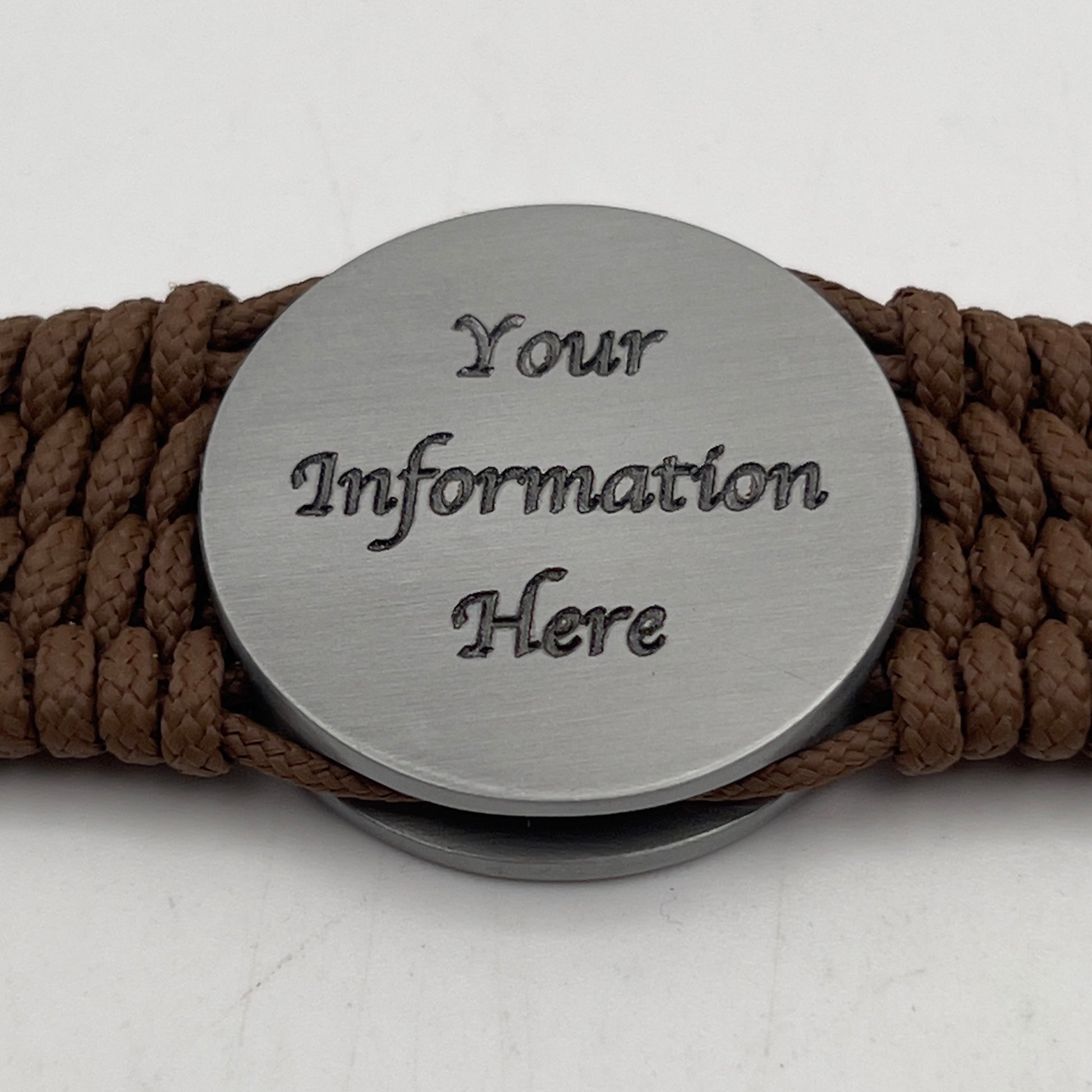 Thin, wide, flexible and comfortable braided United States Marine Corps Iwo Jima bracelet featuring an antique silver plated Iwo Jima flag raising medallion, a silver Cobra style tactical buckle and woven with Coyote Brown Type-1 paracord.
