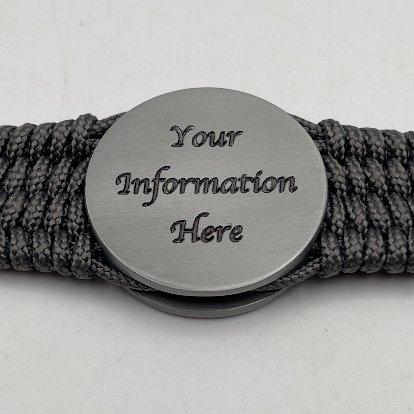 Thin, wide, flexible and comfortable braided United States Marine Corps Iwo Jima bracelet featuring an antique silver plated Iwo Jima flag raising medallion, a silver Cobra style tactical buckle and woven with gray Type-1 paracord.