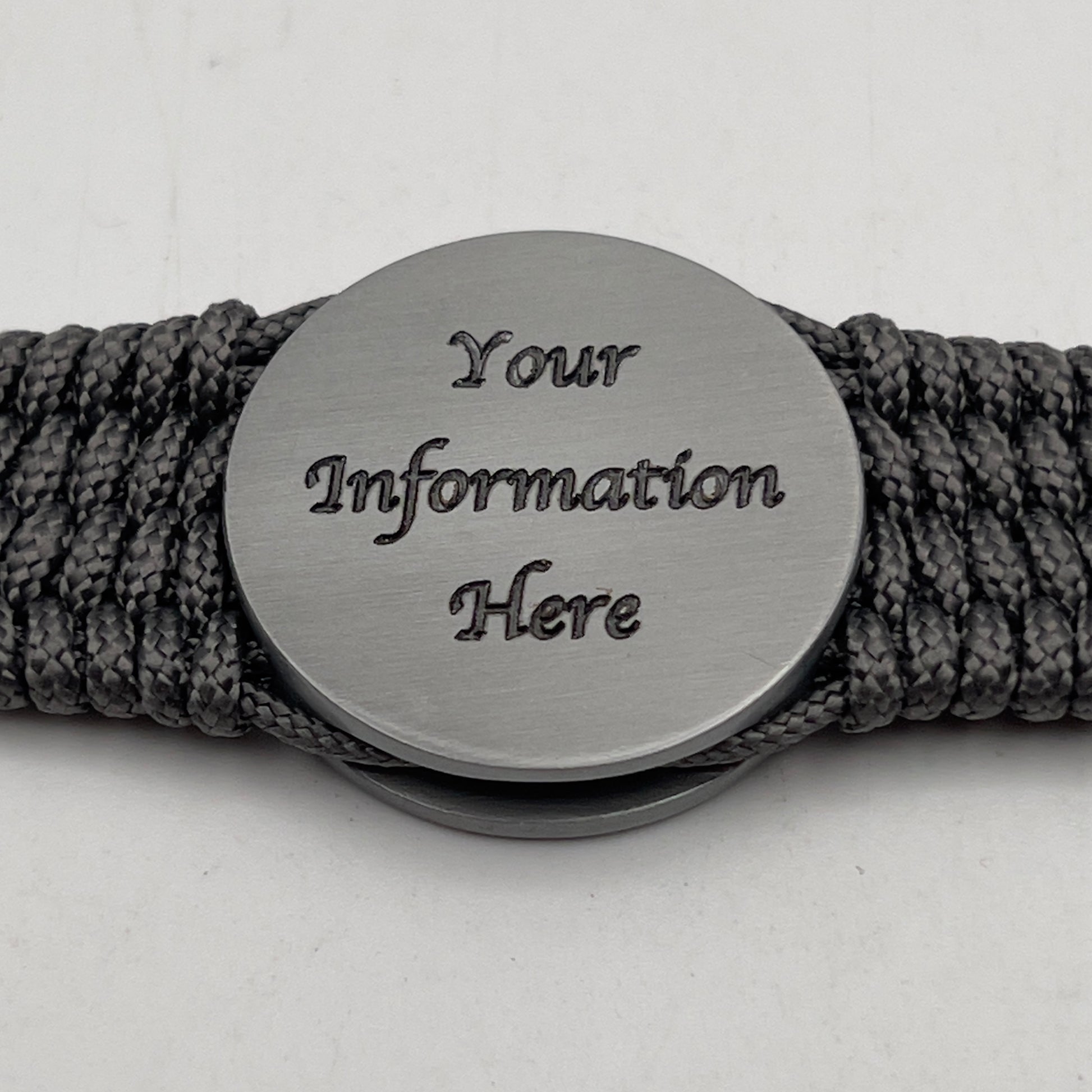 Thin, wide, flexible and comfortable braided United States Marine Corps Iwo Jima bracelet featuring an antique silver plated Iwo Jima flag raising medallion, a silver Cobra style tactical buckle and woven with gray Type-1 paracord.