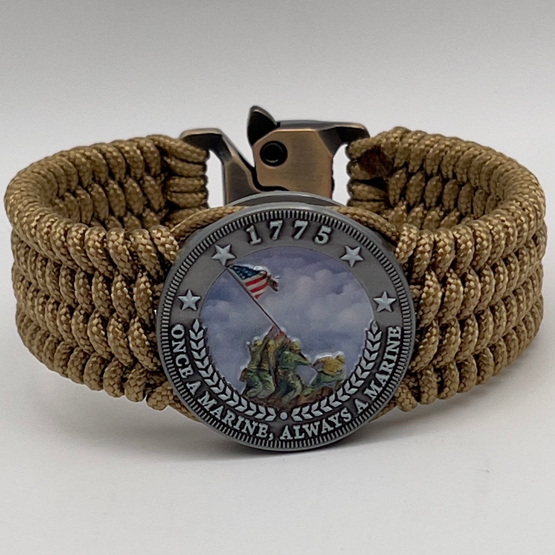 Thin, wide, flexible and comfortable braided United States Marine Corps Iwo Jima bracelet featuring an antique silver plated Iwo Jima flag raising medallion, a gold Cobra style tactical buckle and woven with gold Type-1 paracord.
