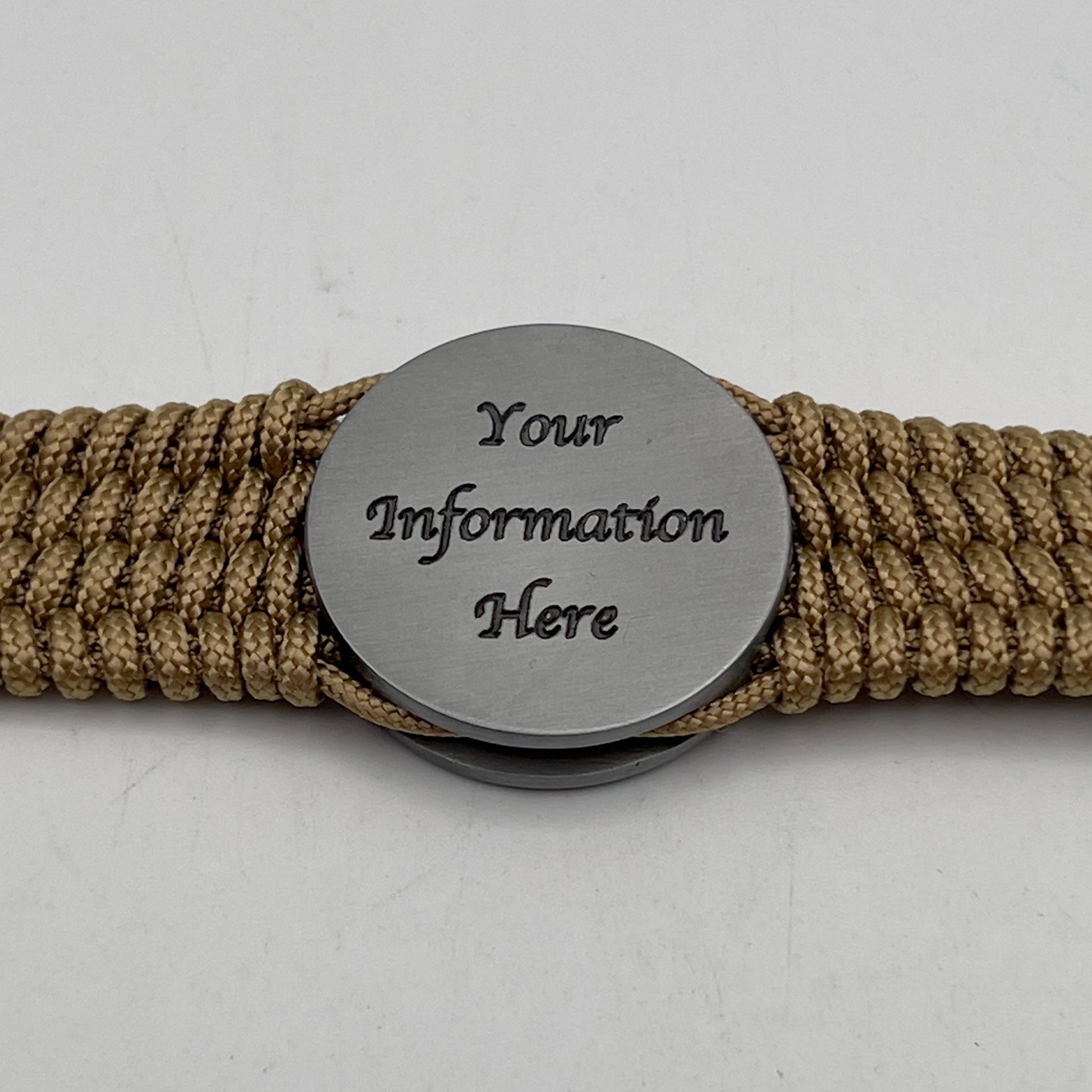 Thin, wide, flexible and comfortable braided United States Marine Corps Iwo Jima bracelet featuring an antique silver plated Iwo Jima flag raising medallion, a gold Cobra style tactical buckle and woven with gold Type-1 paracord.