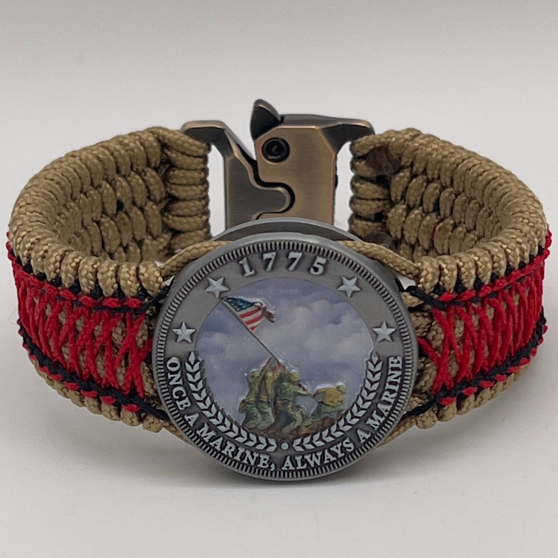 Thin, medium width, flexible and comfortable braided United States Marine Corps Iwo Jima bracelet featuring a UV painted antique silver plated Iwo Jima flag raising medallion, a gold Cobra style tactical buckle and woven with gold Type-1 paracord and Imperial Red and black nano cord.