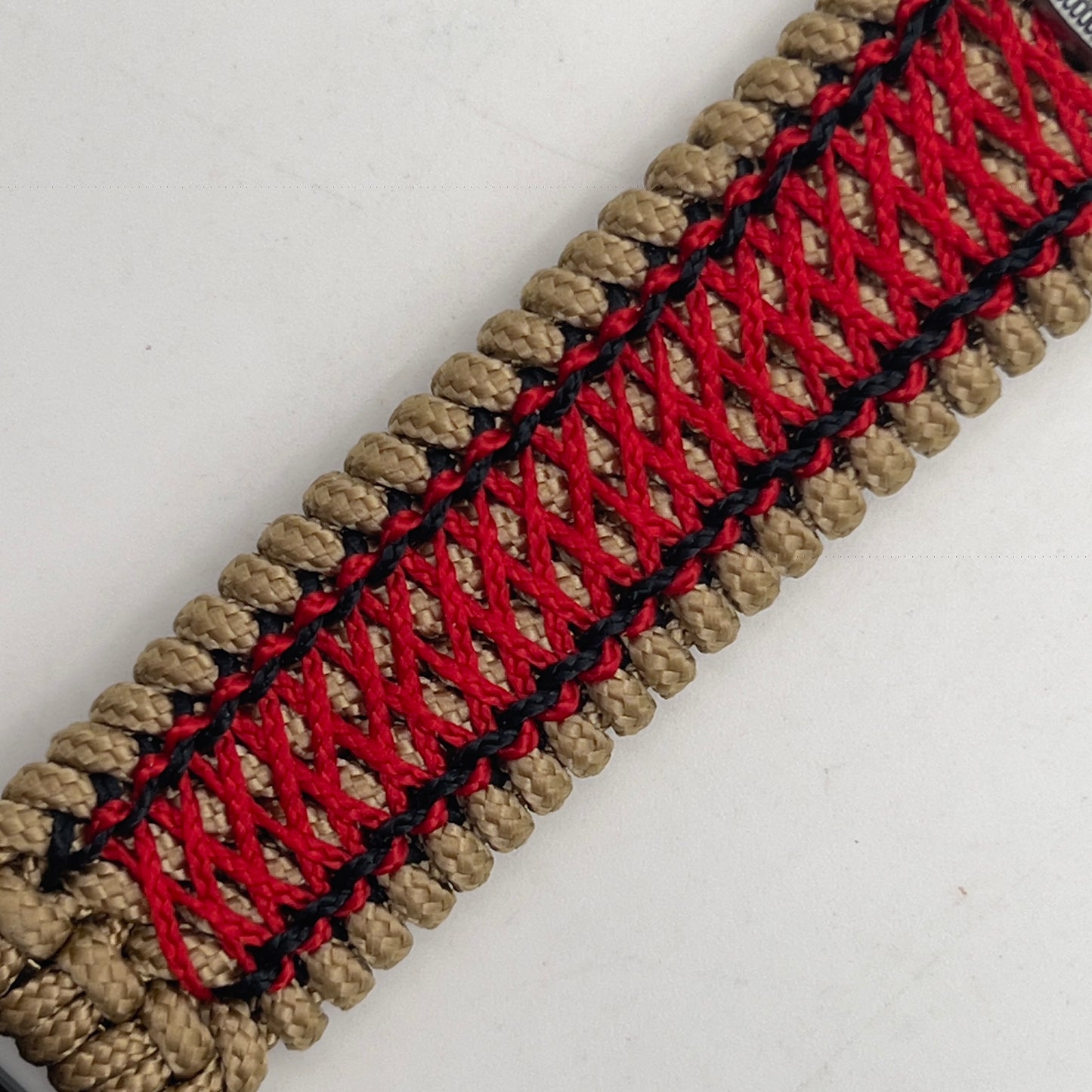 Thin, medium width, flexible and comfortable braided United States Marine Corps Iwo Jima bracelet featuring a UV painted antique silver plated Iwo Jima flag raising medallion, a gold Cobra style tactical buckle and woven with gold Type-1 paracord and Imperial Red and black nano cord.