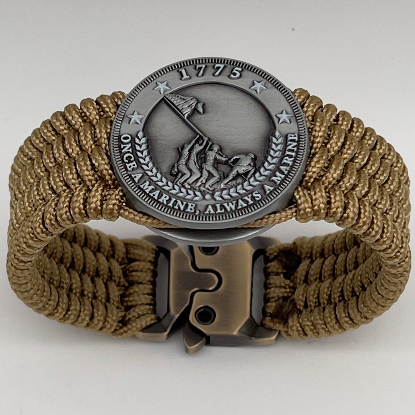 Thin, wide, flexible and comfortable braided United States Marine Corps Iwo Jima bracelet featuring an antique silver plated Iwo Jima flag raising medallion, a gold Cobra style tactical buckle and woven with gold Type-1 paracord.