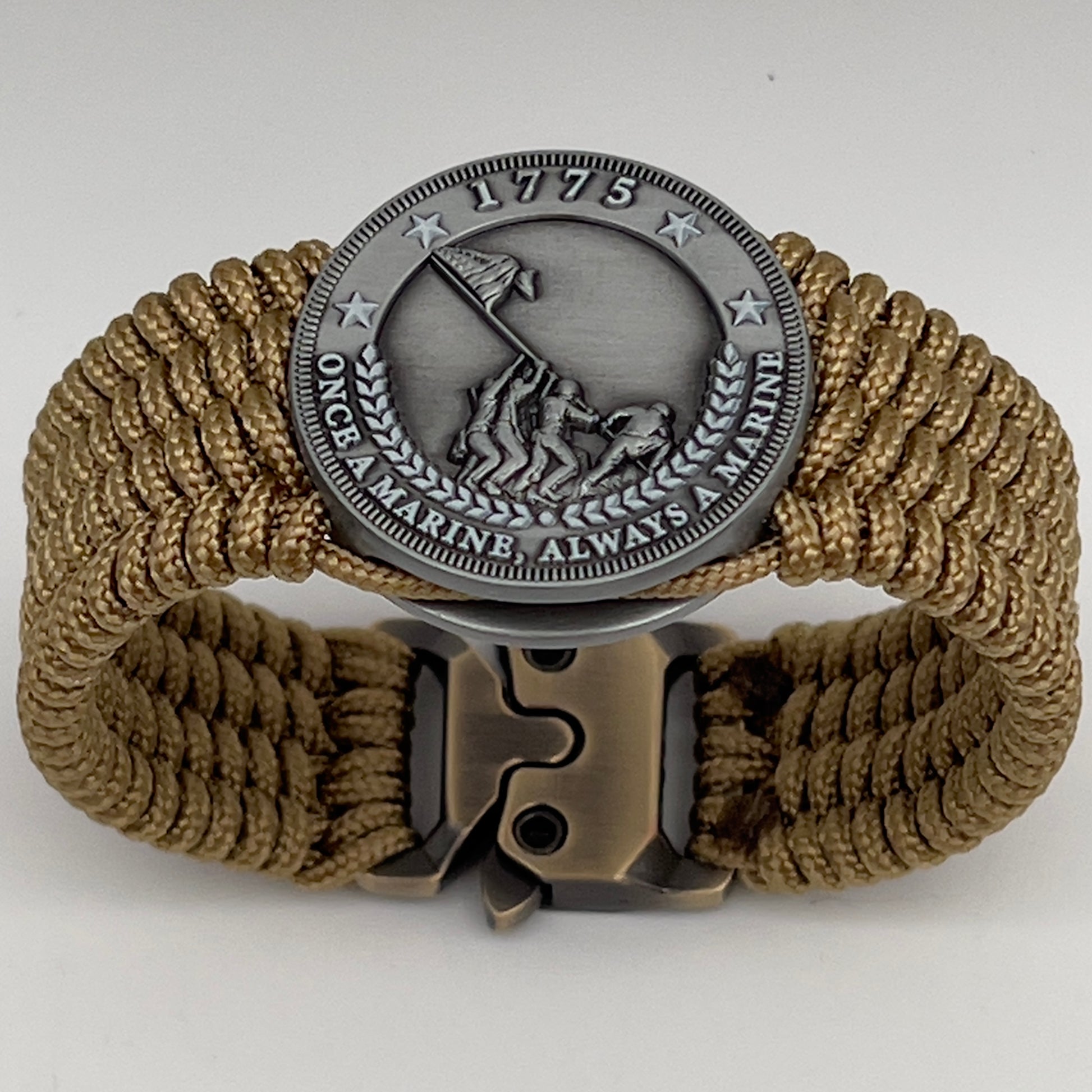 Thin, wide, flexible and comfortable braided United States Marine Corps Iwo Jima bracelet featuring an antique silver plated Iwo Jima flag raising medallion, a gold Cobra style tactical buckle and woven with gold Type-1 paracord.
