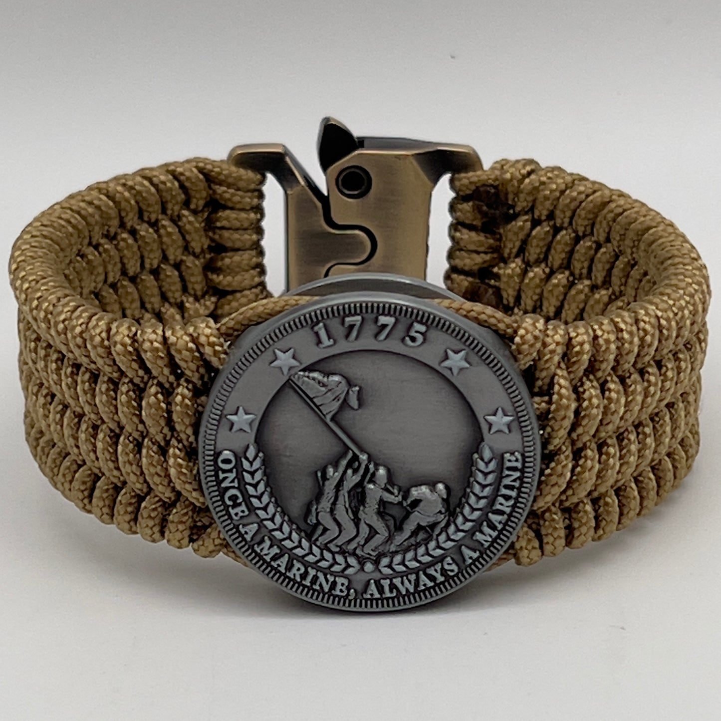 Thin, wide, flexible and comfortable braided United States Marine Corps Iwo Jima bracelet featuring an antique silver plated Iwo Jima flag raising medallion, a gold Cobra style tactical buckle and woven with gold Type-1 paracord.