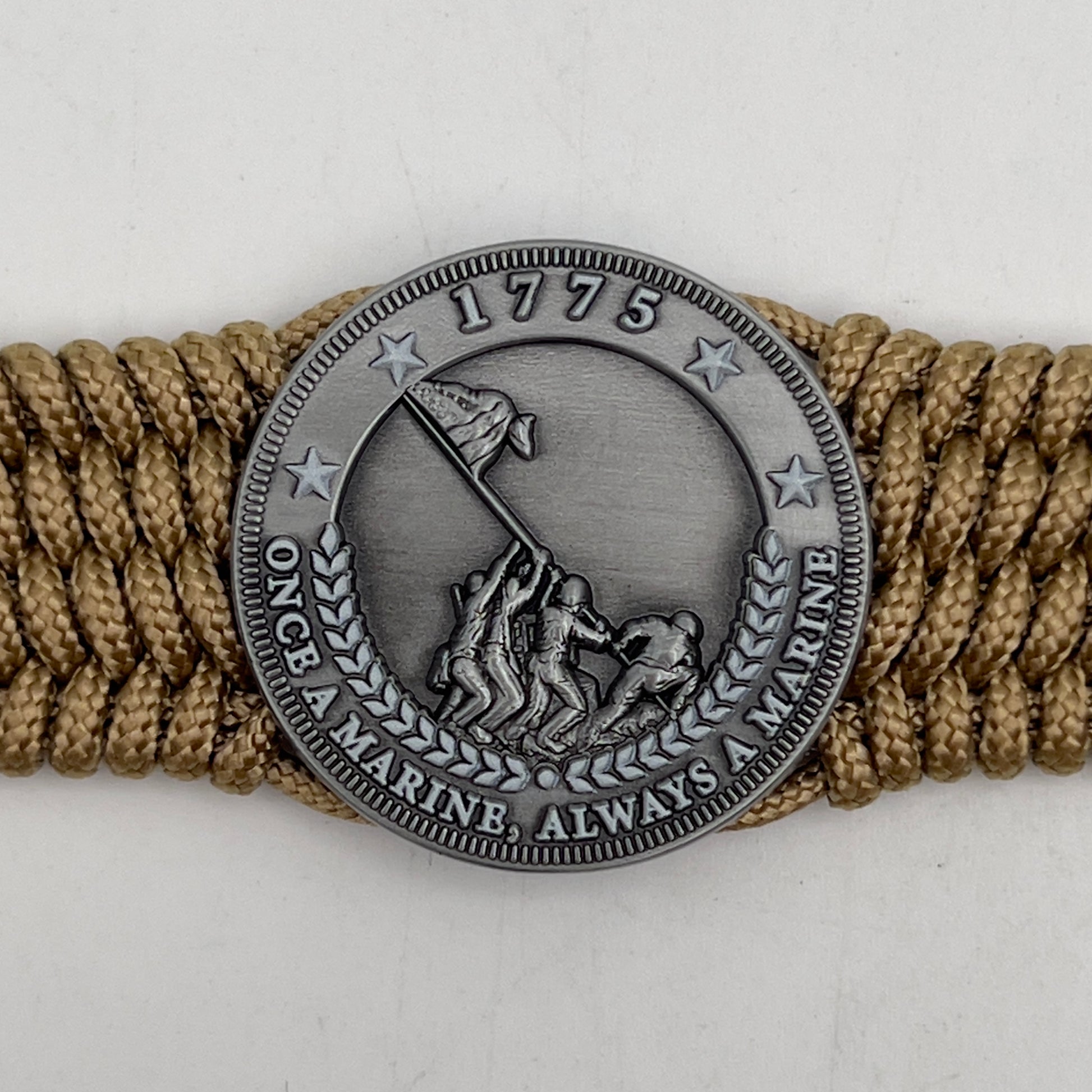 Thin, wide, flexible and comfortable braided United States Marine Corps Iwo Jima bracelet featuring an antique silver plated Iwo Jima flag raising medallion, a gold Cobra style tactical buckle and woven with gold Type-1 paracord.