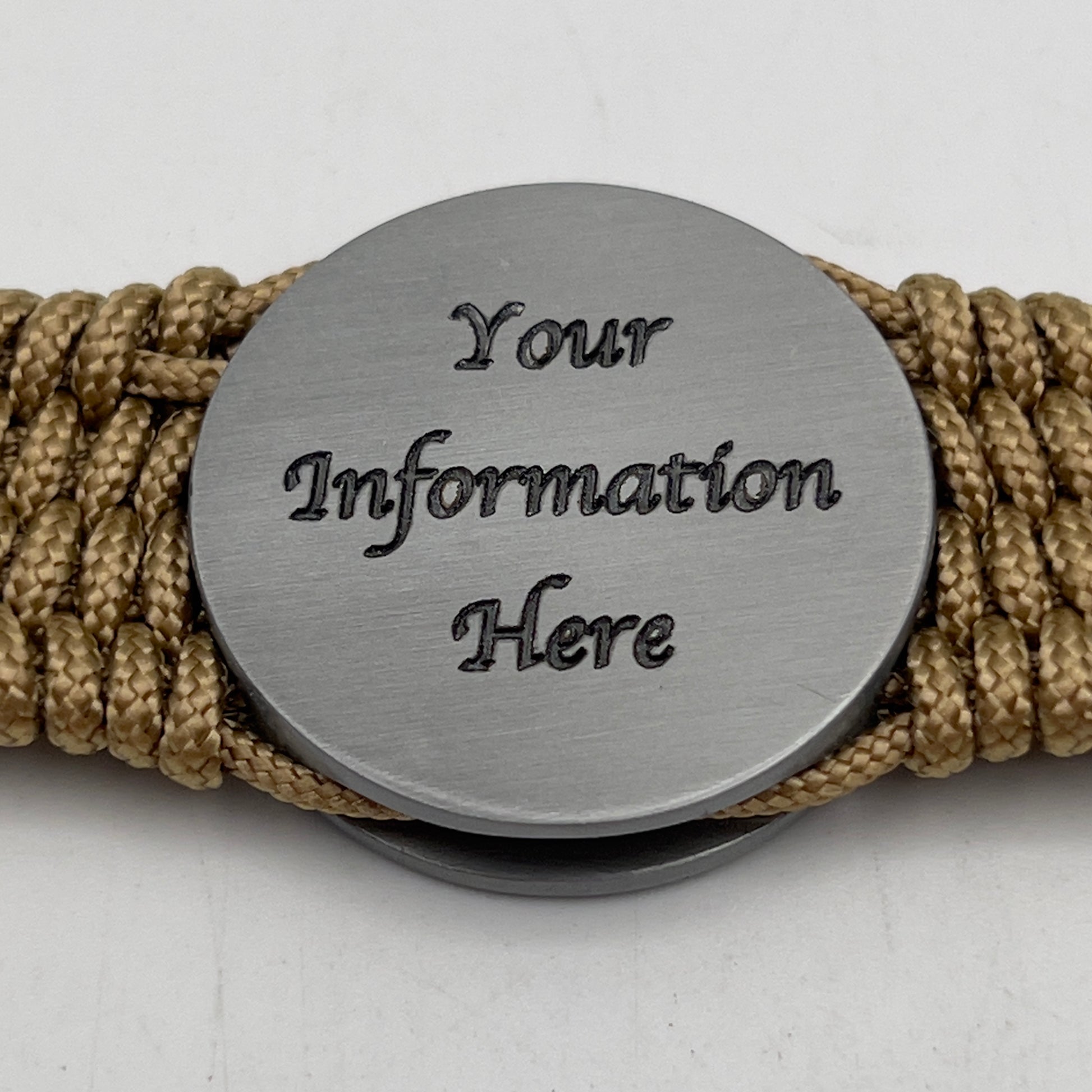 Thick, wide, rigid and comfortable braided United States Marine Corps Iwo Jima bracelet featuring an antique silver plated Iwo Jima flag raising medallion, personalized custom engraving, a gold Cobra style tactical buckle and woven with tan 550 paracord and Imperial Red and black micro cord.