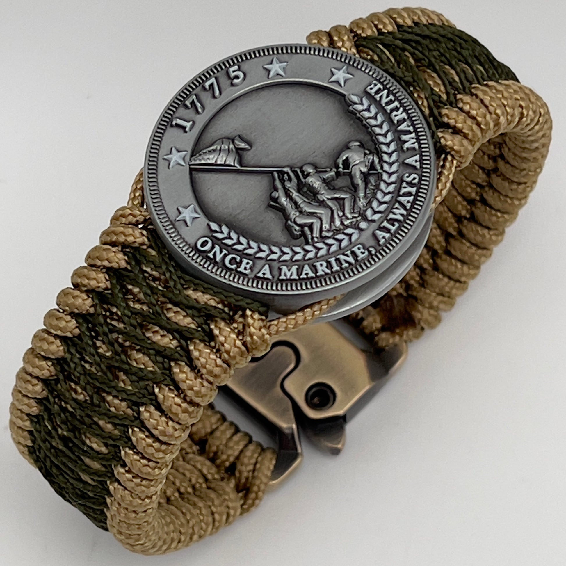 Thin, wide, flexible and comfortable braided United States Marine Corps Iwo Jima bracelet featuring an antique silver plated Iwo Jima flag raising medallion, a gold Cobra style tactical buckle and woven with gold Type-1 paracord and Olive Drab nano cord.