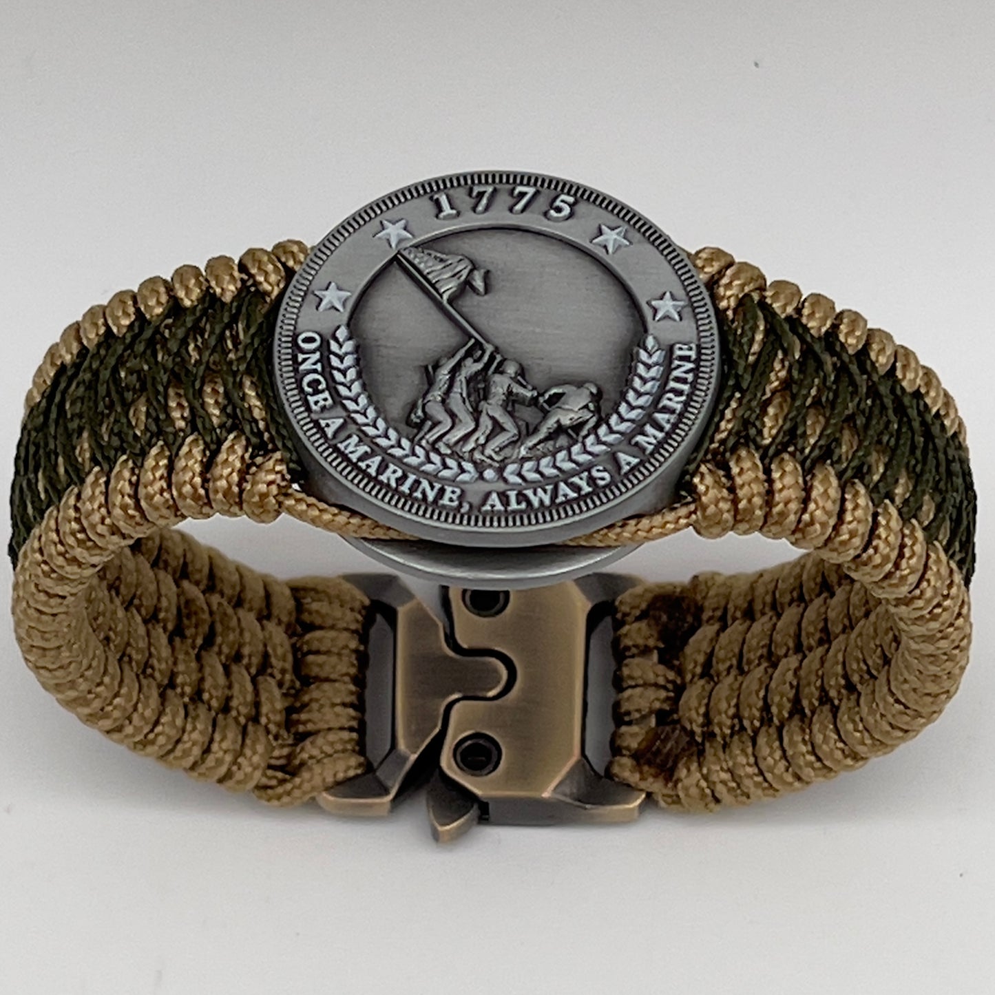 Thin, wide, flexible and comfortable braided United States Marine Corps Iwo Jima bracelet featuring an antique silver plated Iwo Jima flag raising medallion, a gold Cobra style tactical buckle and woven with gold Type-1 paracord and Olive Drab nano cord.