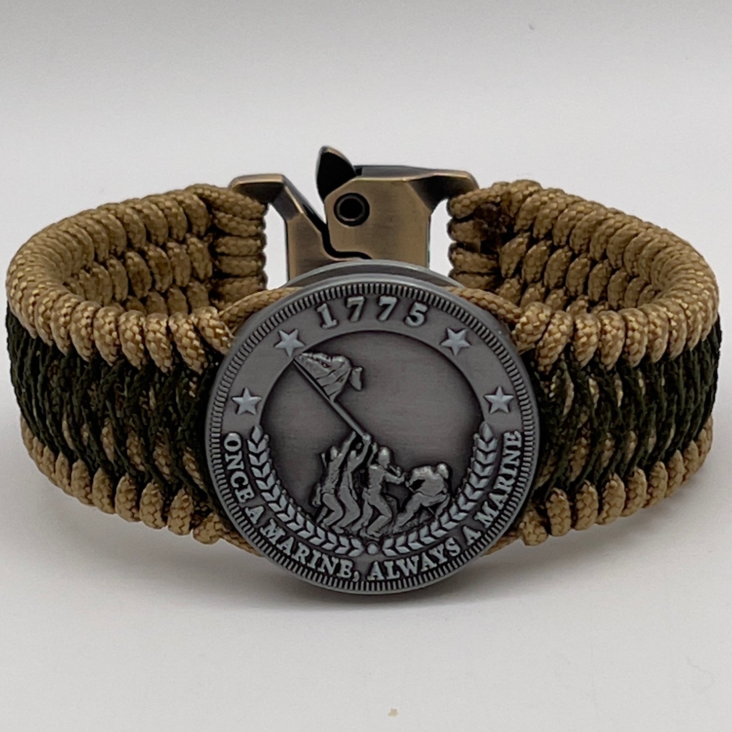 Thin, wide, flexible and comfortable braided United States Marine Corps Iwo Jima bracelet featuring an antique silver plated Iwo Jima flag raising medallion, a gold Cobra style tactical buckle and woven with gold Type-1 paracord and Olive Drab nano cord.