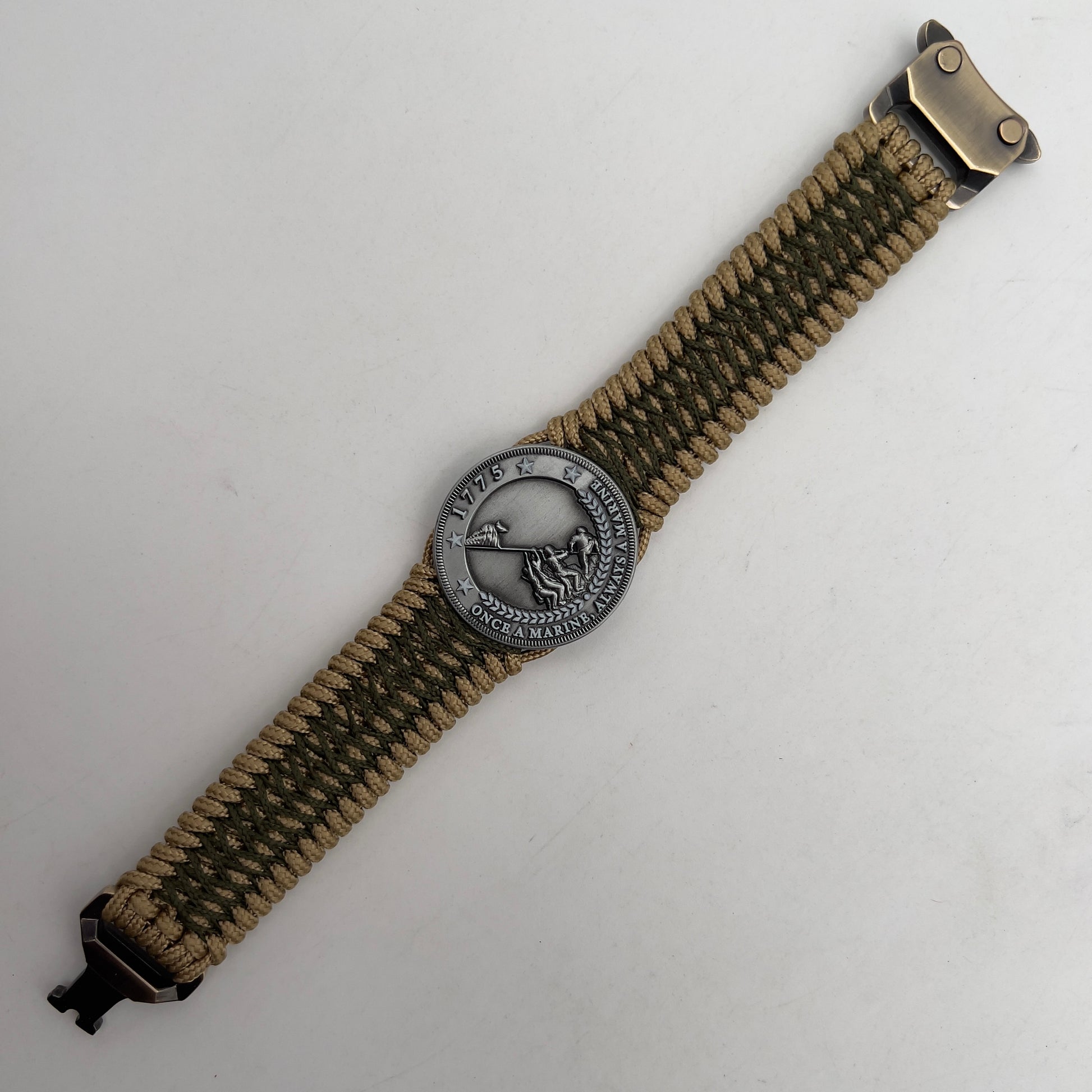 Thin, wide, flexible and comfortable braided United States Marine Corps Iwo Jima bracelet featuring an antique silver plated Iwo Jima flag raising medallion, a gold Cobra style tactical buckle and woven with gold Type-1 paracord and Olive Drab nano cord.