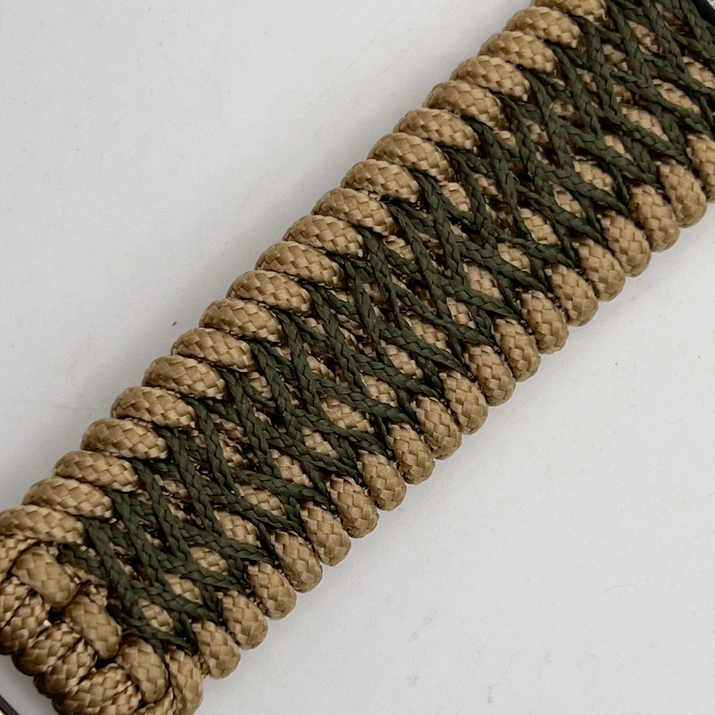 Thin, wide, flexible and comfortable braided United States Marine Corps Iwo Jima bracelet featuring an antique silver plated Iwo Jima flag raising medallion, a gold Cobra style tactical buckle and woven with gold Type-1 paracord and Olive Drab nano cord.