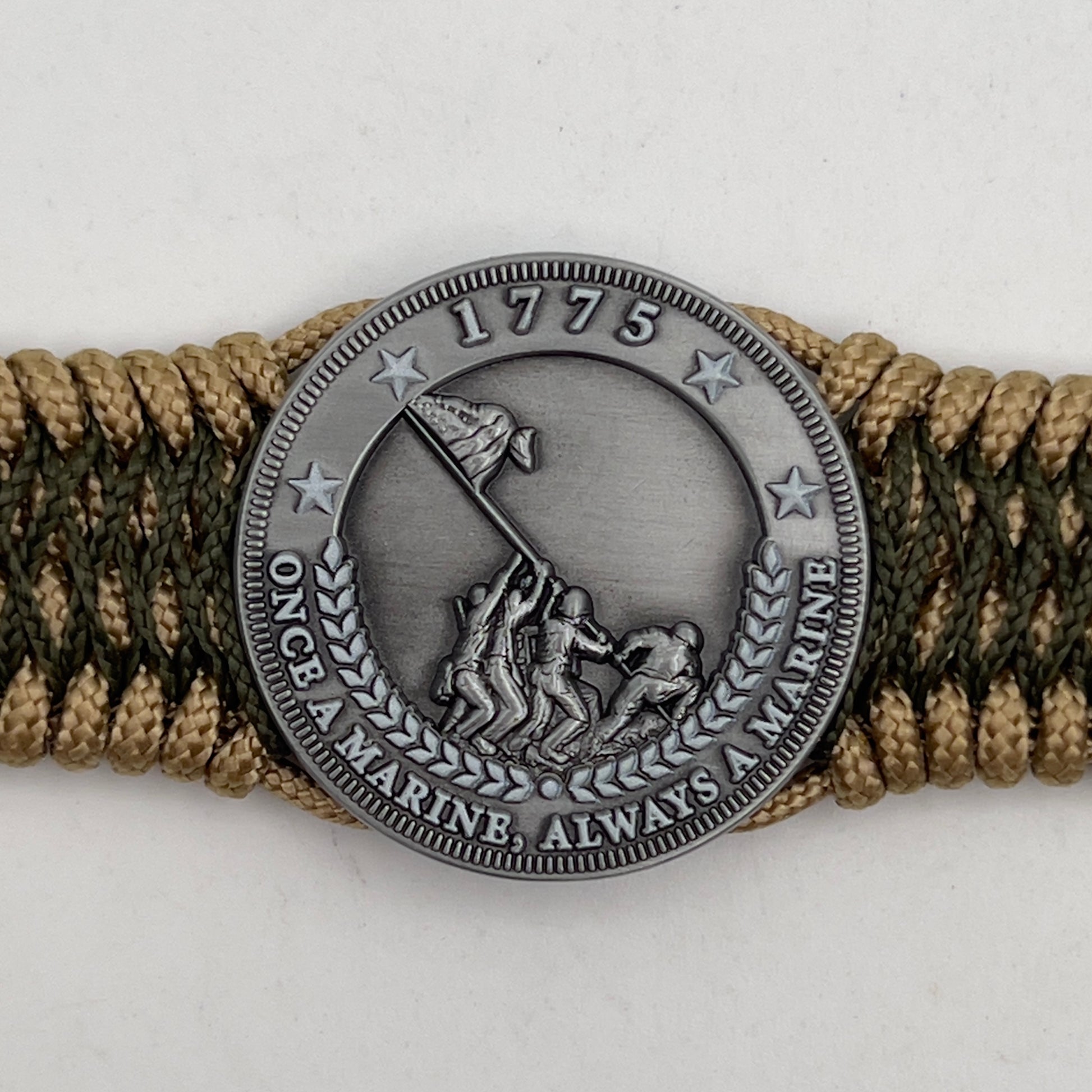 Thin, wide, flexible and comfortable braided United States Marine Corps Iwo Jima bracelet featuring an antique silver plated Iwo Jima flag raising medallion, a gold Cobra style tactical buckle and woven with gold Type-1 paracord and Olive Drab nano cord.