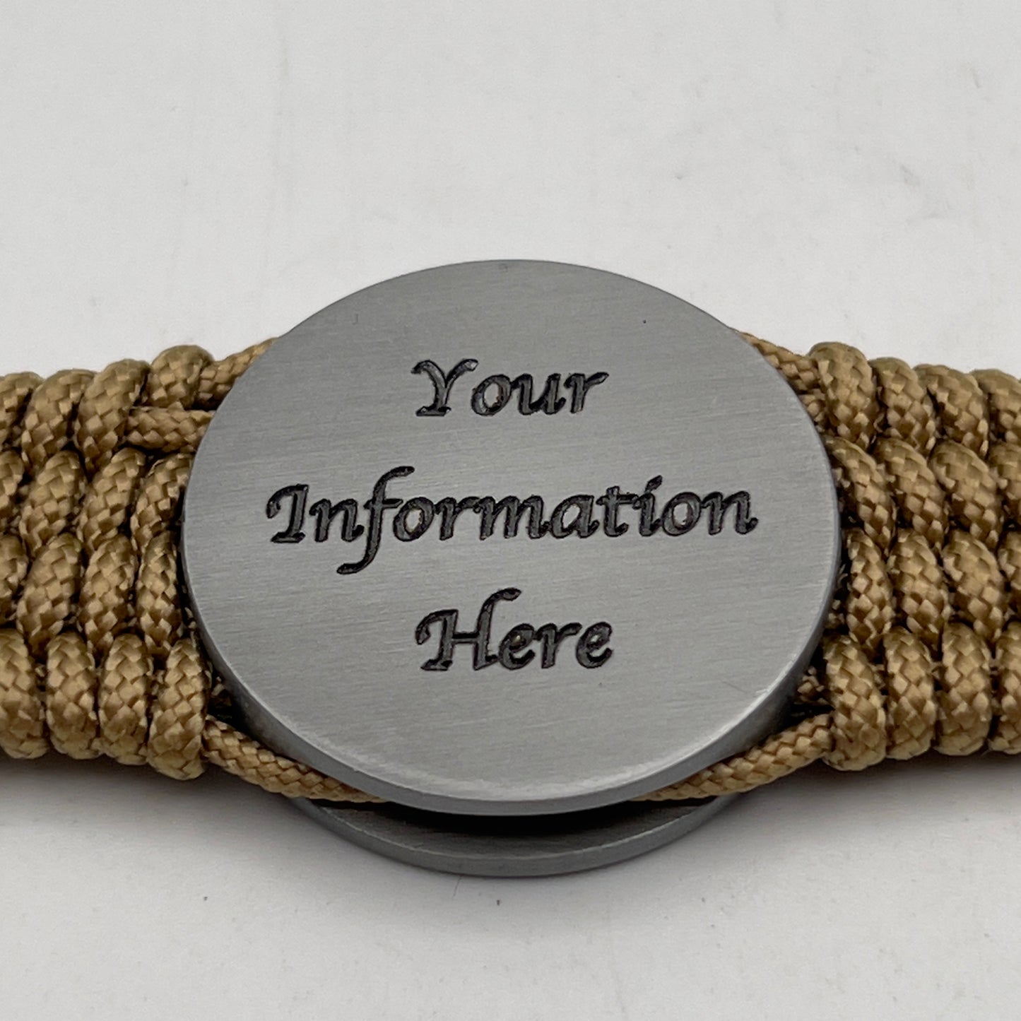 Thin, wide, flexible and comfortable braided United States Marine Corps Iwo Jima bracelet featuring an antique silver plated Iwo Jima flag raising medallion, a gold Cobra style tactical buckle and woven with gold Type-1 paracord and Olive Drab nano cord.
