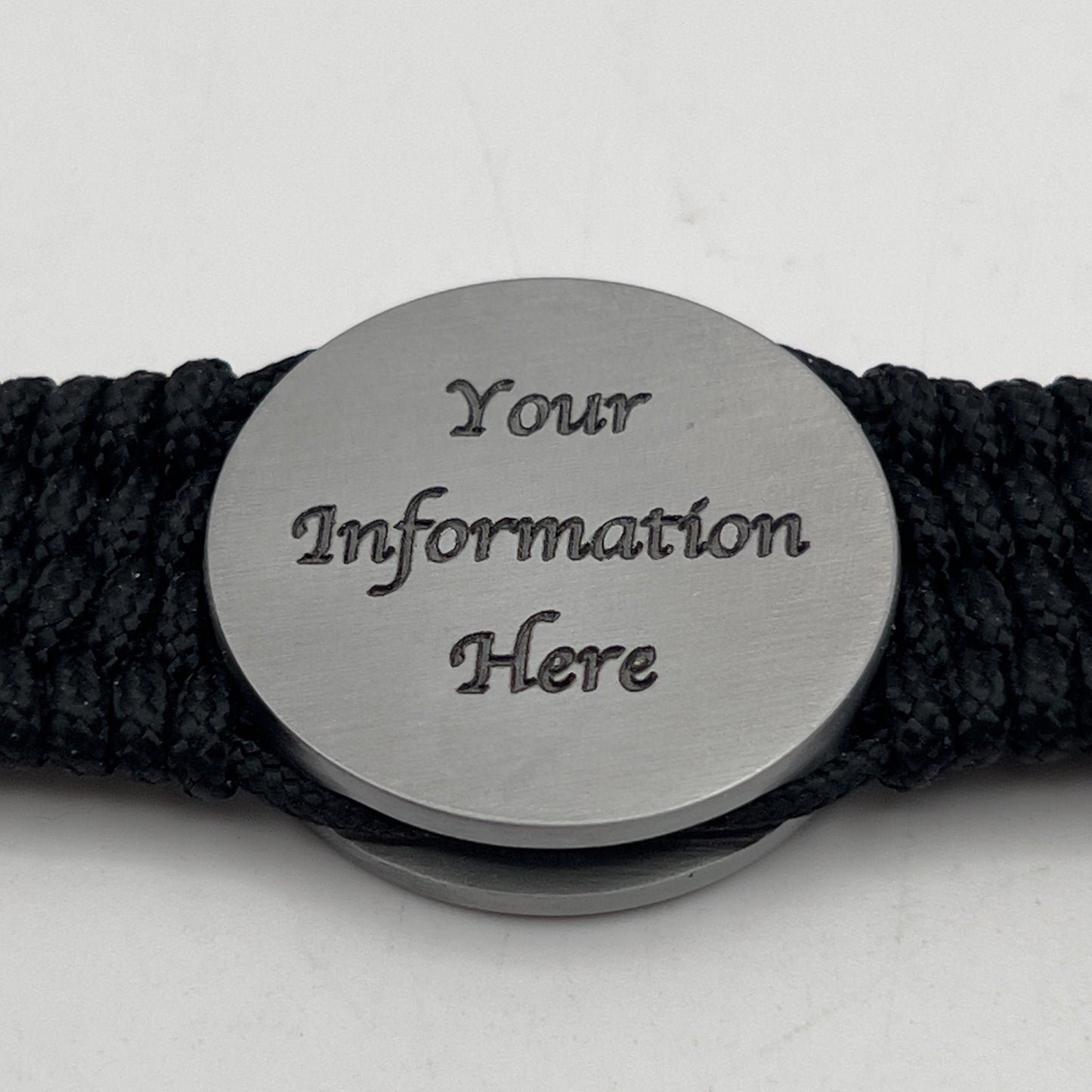 Thin, wide, flexible and comfortable braided United States Marine Corps Iwo Jima bracelet featuring an antique silver plated UV painted Iwo Jima flag raising medallion, a black Cobra style tactical buckle and woven with black Type-1 paracord.