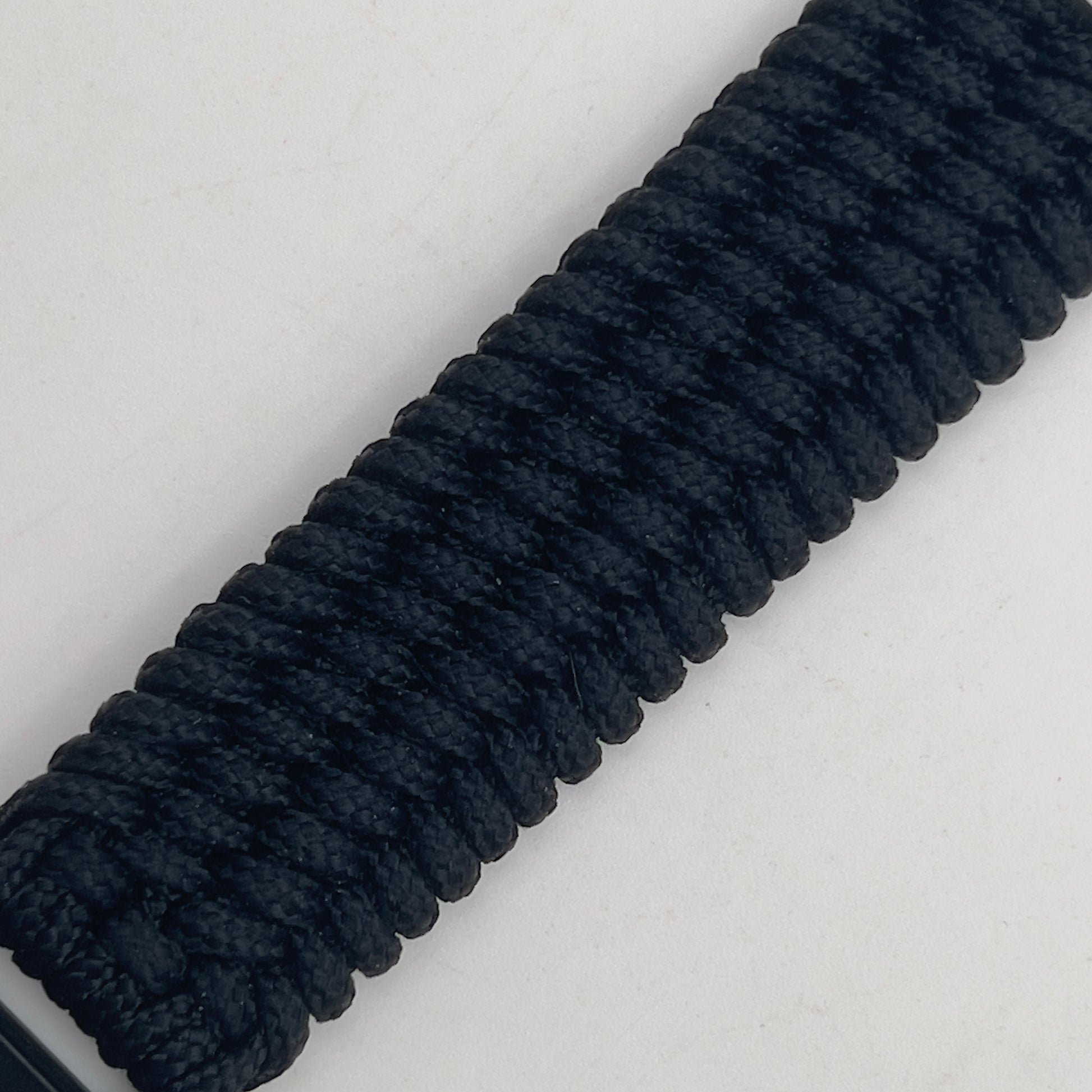 Thin, wide, flexible and comfortable braided United States Marine Corps Iwo Jima bracelet featuring an antique silver plated Iwo Jima flag raising medallion, a black Cobra style tactical buckle and woven with black Type-1 paracord.