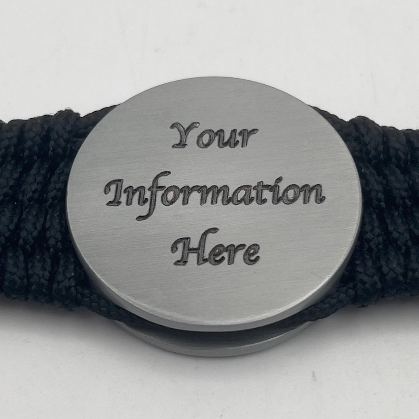 Thick, wide, rigid and comfortable braided United States Marine Corps Iwo Jima bracelet featuring an antique silver plated UV painted Iwo Jima flag raising medallion, personalized custom engraving, a black Cobra style tactical buckle and woven with black 550 paracord and Imperial Red and Gold micro cord.