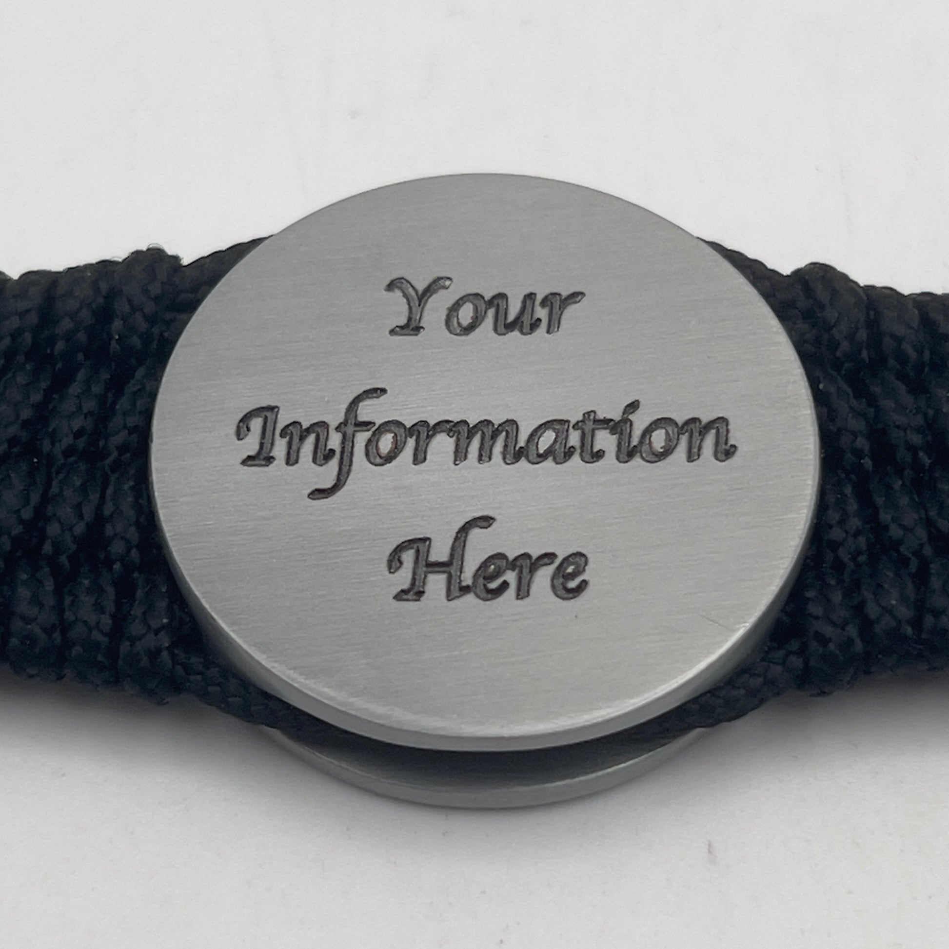 Thick, wide, rigid and comfortable braided United States Marine Corps Iwo Jima bracelet featuring an antique silver plated UV painted Iwo Jima flag raising medallion, personalized custom engraving, a black Cobra style tactical buckle and woven with black 550 paracord and Imperial Red and Gold micro cord.