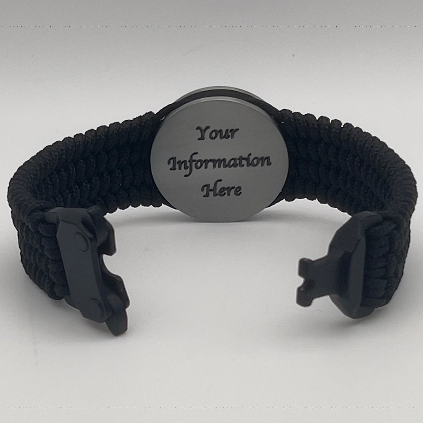Thin, wide, flexible and comfortable braided United States Marine Corps Iwo Jima bracelet featuring an antique silver plated Iwo Jima flag raising medallion, a black Cobra style tactical buckle and woven with black Type-1 paracord.