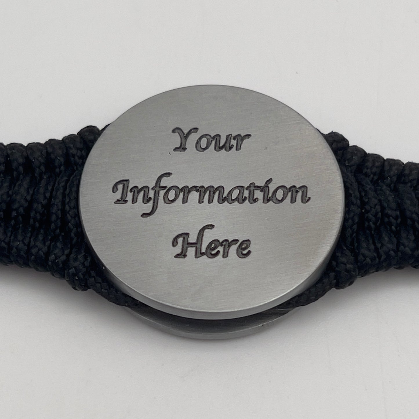 Thin, narrow and comfortable braided United States Marine Corps Iwo Jima bracelet featuring an antique silver plated UV painted Iwo Jima flag raising medallion, a black Cobra style tactical buckle and woven with black type-1 paracord.