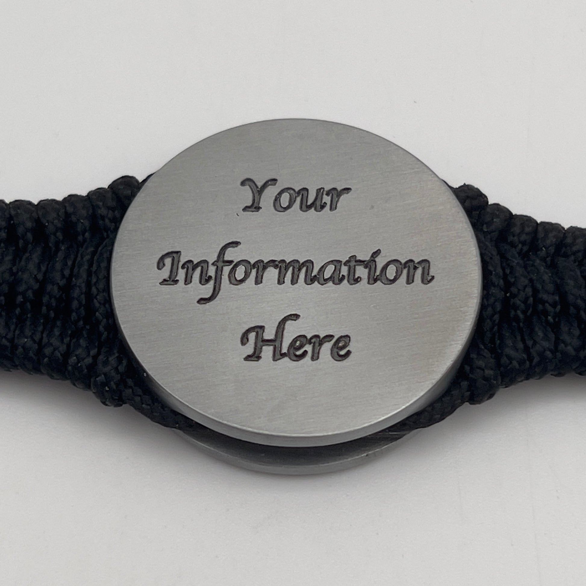 Thin, narrow and comfortable braided United States Marine Corps Iwo Jima bracelet featuring an antique silver plated UV painted Iwo Jima flag raising medallion, a black Cobra style tactical buckle and woven with black type-1 paracord.