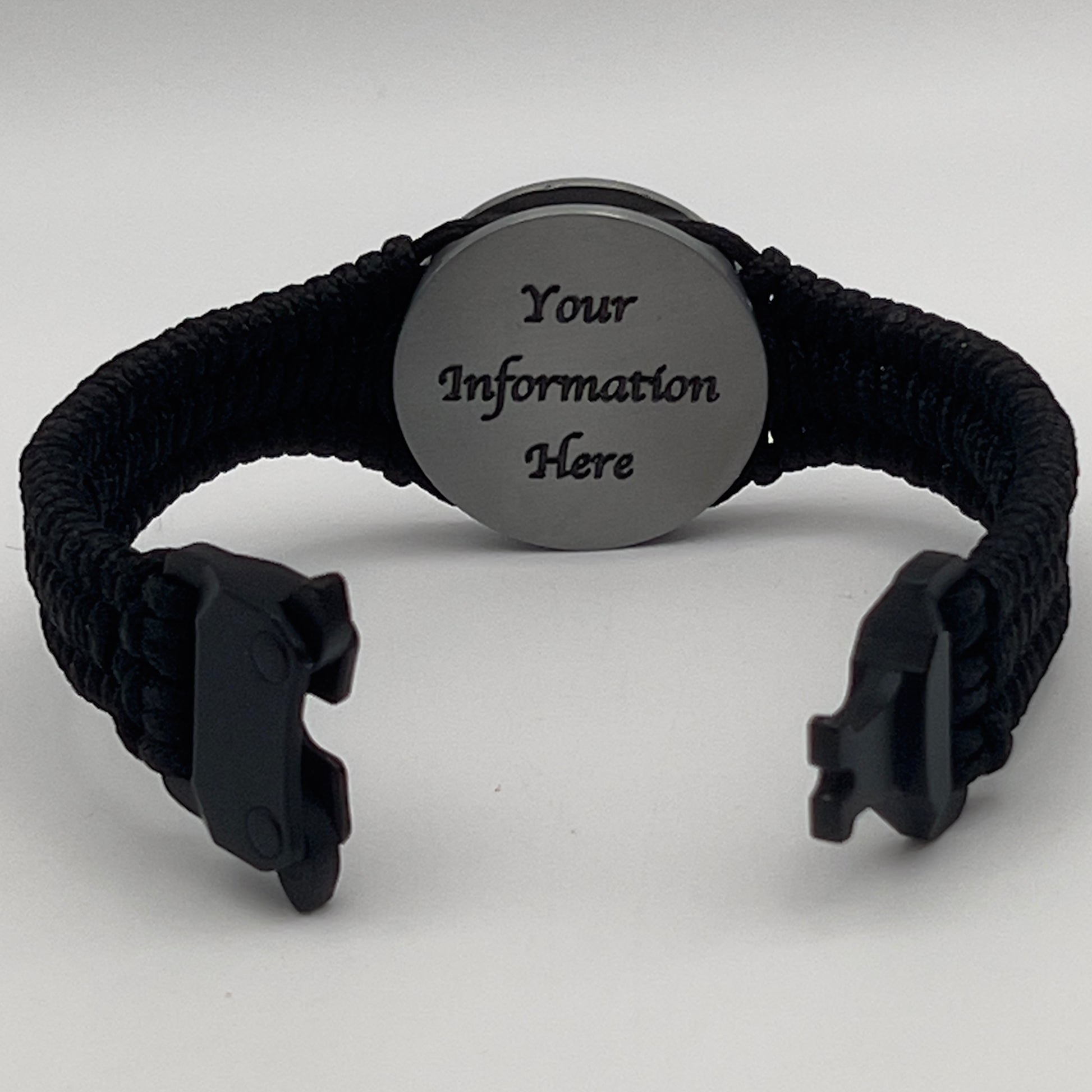 Thin, narrow and comfortable braided United States Marine Corps Iwo Jima bracelet featuring an antique silver plated UV painted Iwo Jima flag raising medallion, a black Cobra style tactical buckle and woven with black type-1 paracord.