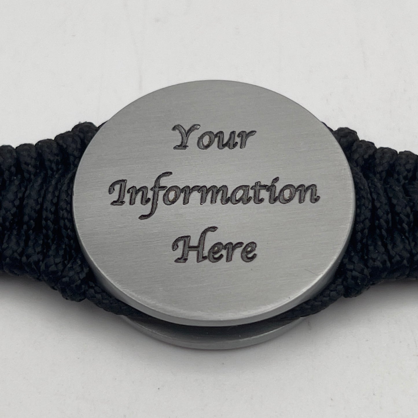 Thick, narrow and comfortable braided United States Marine Corps Iwo Jima bracelet featuring an antique silver plated UV painted Iwo Jima flag raising medallion, a silver Cobra style tactical buckle and woven with black 550 cord and Imperial Red and gold micro cord.