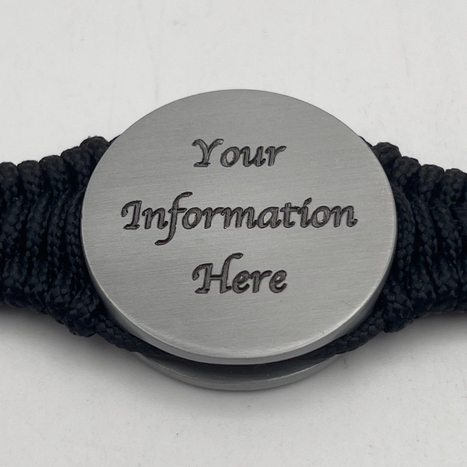 Thick, narrow and comfortable braided United States Marine Corps Iwo Jima bracelet featuring an antique silver plated UV painted Iwo Jima flag raising medallion, a silver Cobra style tactical buckle and woven with black 550 cord and Imperial Red and gold micro cord.