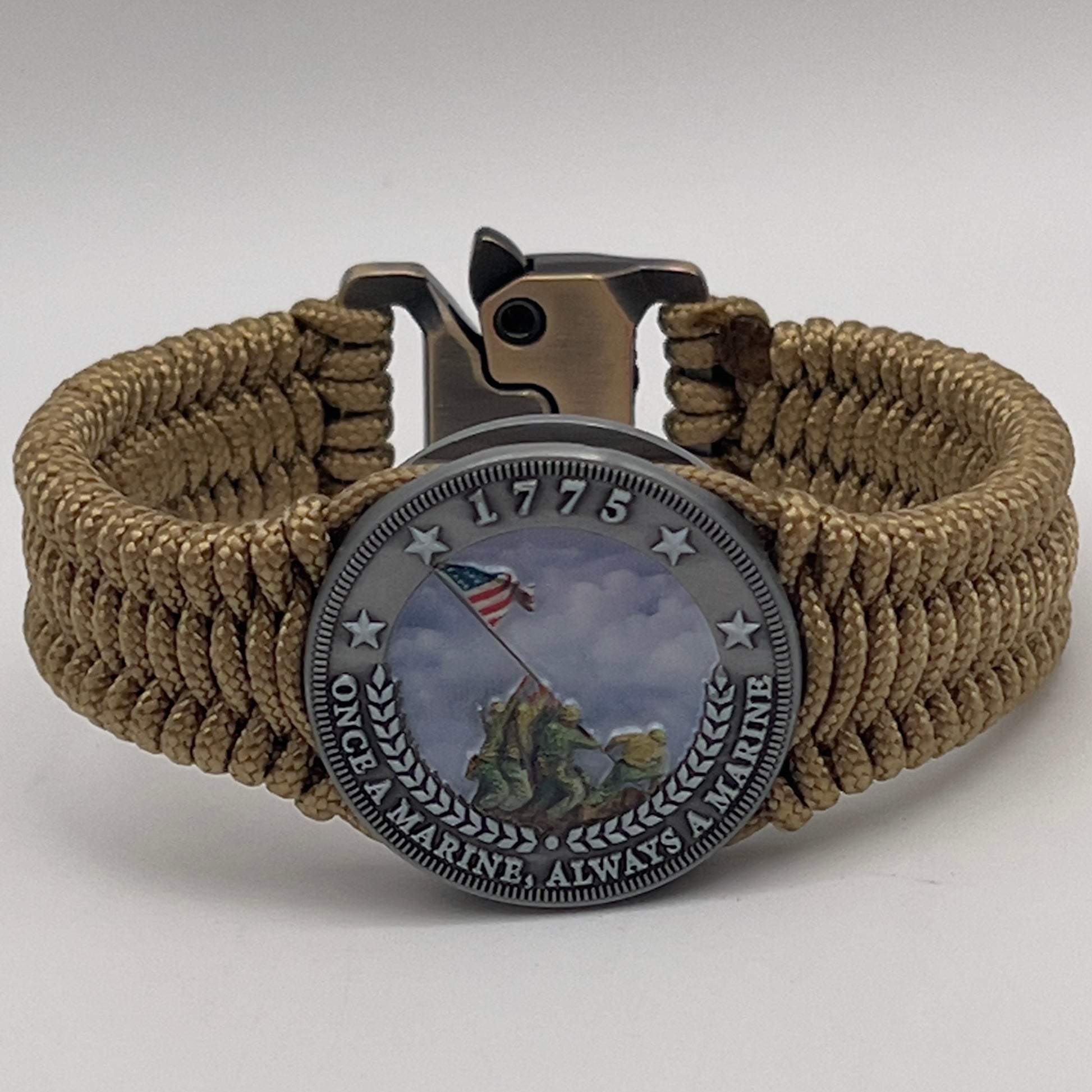 Thin, narrow, flexible and comfortable braided United States Marine Corps Iwo Jima bracelet featuring an antique silver plated UV painted Iwo Jima flag raising medallion, a gold Cobra style tactical buckle and woven with gold type-1 paracord.