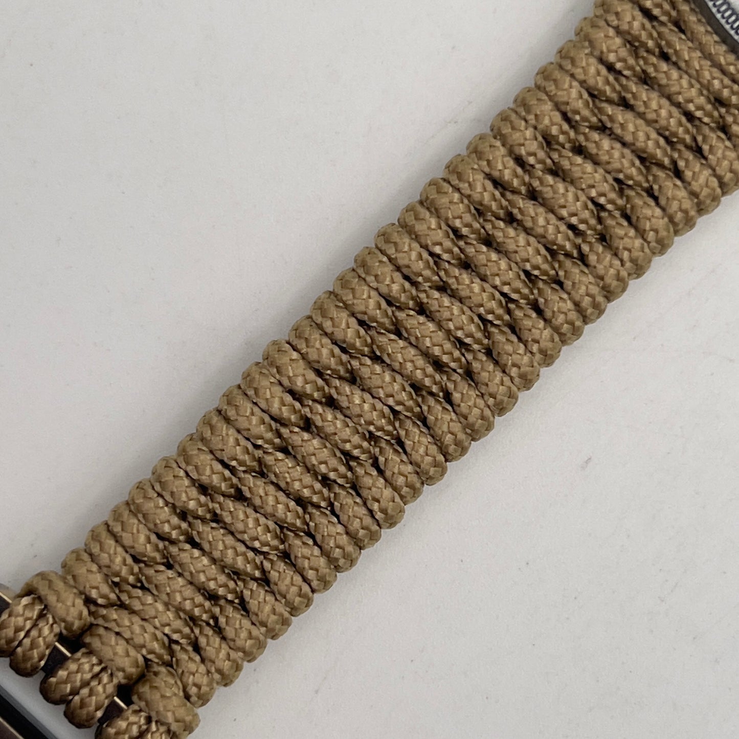 Thin, narrow, flexible and comfortable braided United States Marine Corps Iwo Jima bracelet featuring an antique silver plated UV painted Iwo Jima flag raising medallion, a gold Cobra style tactical buckle and woven with gold type-1 paracord.