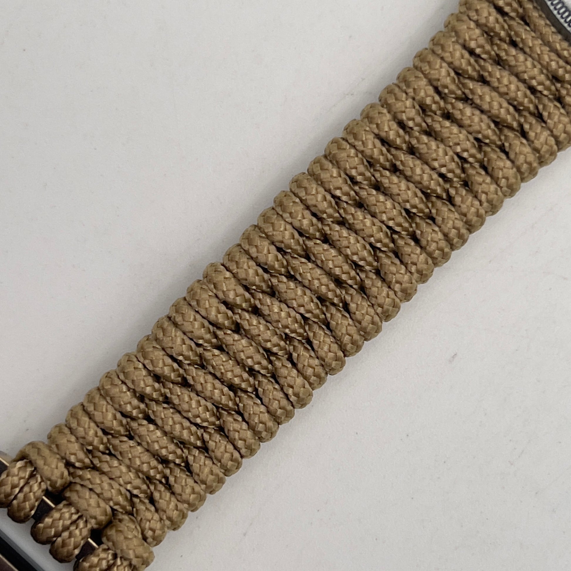 Thin, narrow, flexible and comfortable braided United States Marine Corps Iwo Jima bracelet featuring an antique silver plated UV painted Iwo Jima flag raising medallion, a gold Cobra style tactical buckle and woven with gold type-1 paracord.