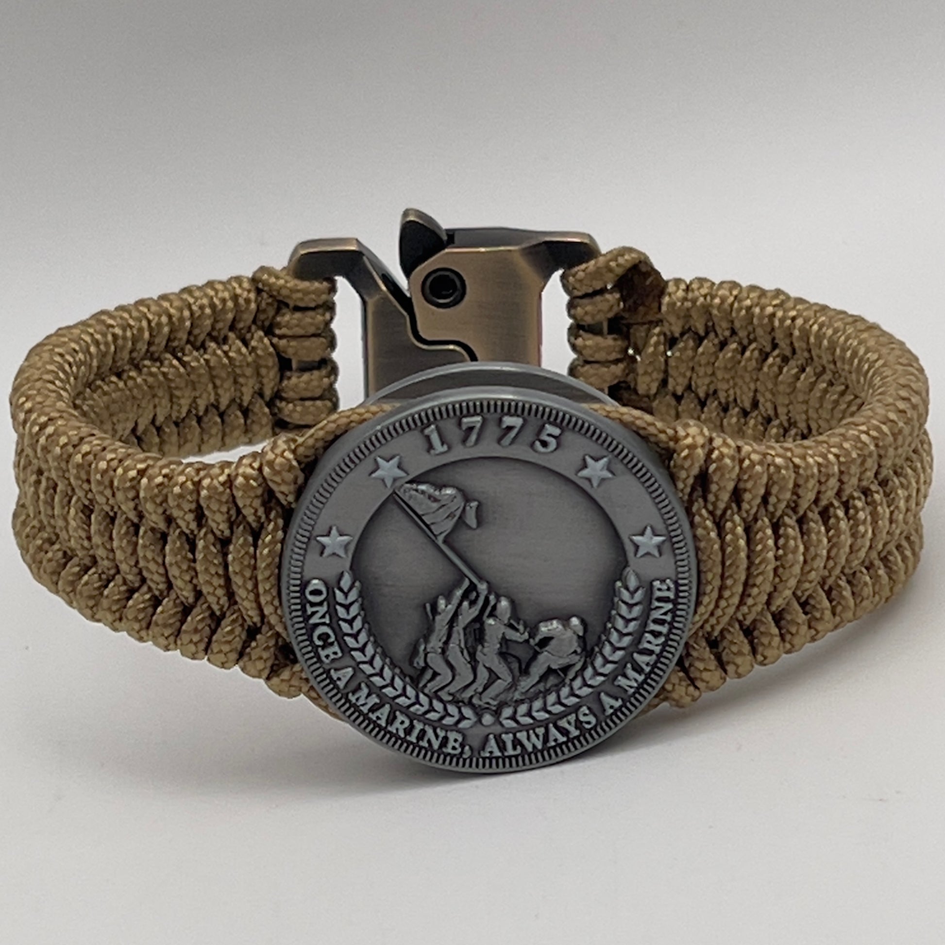 Thin, narrow, flexible and comfortable braided United States Marine Corps Iwo Jima bracelet featuring an antique silver plated Iwo Jima flag raising medallion, a gold Cobra style tactical buckle and woven with gold type-1 paracord.