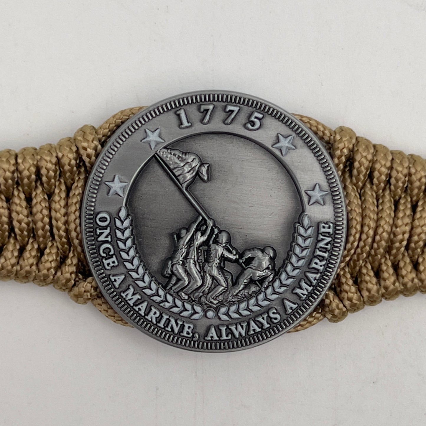 Thin, narrow, flexible and comfortable braided United States Marine Corps Iwo Jima bracelet featuring an antique silver plated Iwo Jima flag raising medallion, a gold Cobra style tactical buckle and woven with gold type-1 paracord.